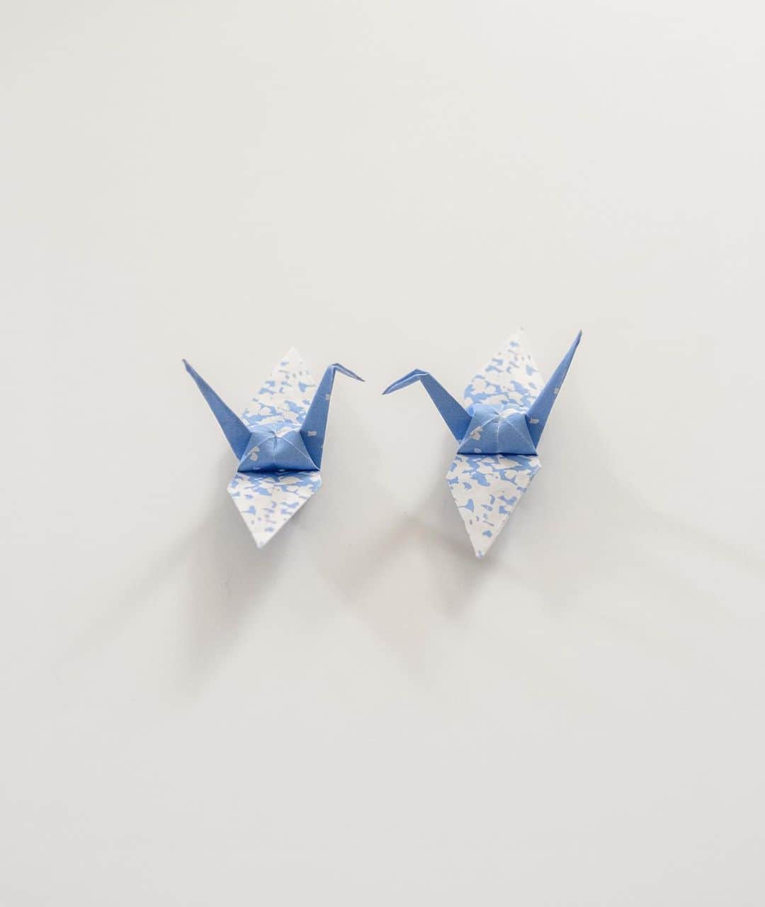 Shing02さんのインスタグラム写真 - (Shing02Instagram)「e22.com/opc folding peace cranes with patterns from fukushima daiichi nuclear power plant  this is an idea that I wanted to do for 12years but due to the national trauma of the earthquake, tsunami, and nuclear disaster I wanted to wait for the appropriate time.  I sampled the building pattern (the power plant's third iteration paint job inspired by sky and birds) and incorporated it into the DPM swatches on the site.  it's a reminder of the lingering issues surrounding the use of uranium as a fuel source, since a nuclear reactor was originally a tool to brew plutonium (not necessary to isolate fissile uranium), and only after WWII they attached a steam turbine to generate electricity while continuing to stockpile "reprocessed" plutonium. 🕊️」10月18日 12時56分 - shing02gram