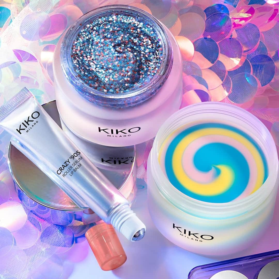 KIKO MILANOのインスタグラム：「Have you given these #KIKOCrazy90s skincare goodies a try yet? 🤩⁣ ✨ Treat your skin and feel refreshed with the Make Me Glitter Face Mask ⁣ ✨ Get a boost of hydration with the Unicorn Nourishing Body Cream ⁣ ✨ Pamper and plump up your lips with our Roller Serum Lip Balm ⁣ Head to your nearest #KIKOStore and check them out 😉⁣ ⁣ Make Me Glitter Face Mask - Unicorn Nourishing Body Cream - Colour Explosion Eyeshadow Palette 02 - Roller Serum Lip Balm ⁣」