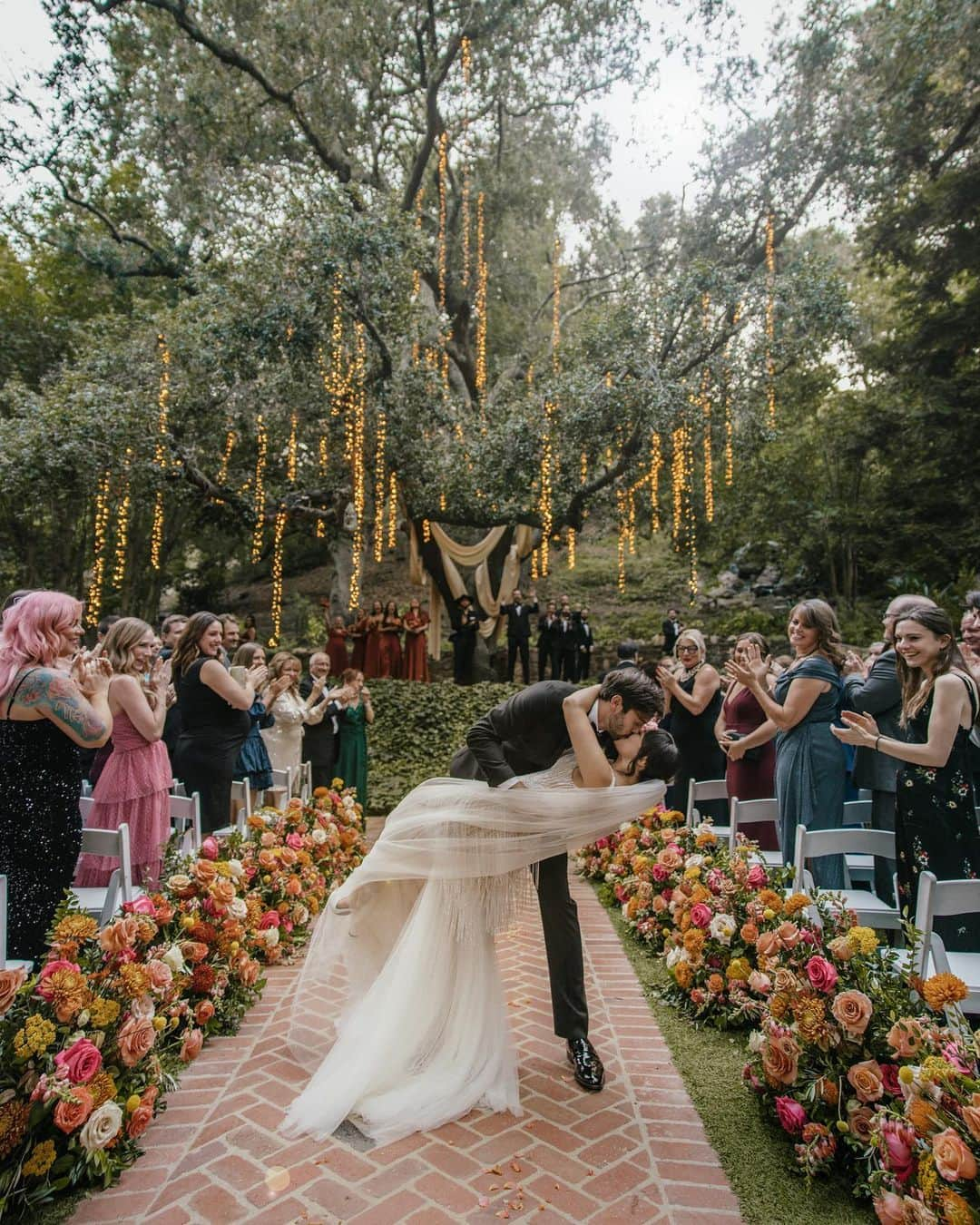 ヘイレイ・オランティアのインスタグラム：「It’s all in the details 💍 We will be reminiscing on these memories forever! Thank you to all of our incredible vendors for making this evening so special!  • • Photography @taryndudley  Venue @calamigosguestranch  Planner @karlispanglerevents Florals @joyofbloomflorals Band @jordankahnorchestra DJ @secondsong_official  Rentals @premiere_rents / @adorefolklore  Dress @lizmartinezbridal  Installations @thejoyhaven  Signage @studioyella  Cake @vanillabakeshop Videography @kindlyweddings  Digital Content @giftsforthegirls  Pizza @pizzahut」