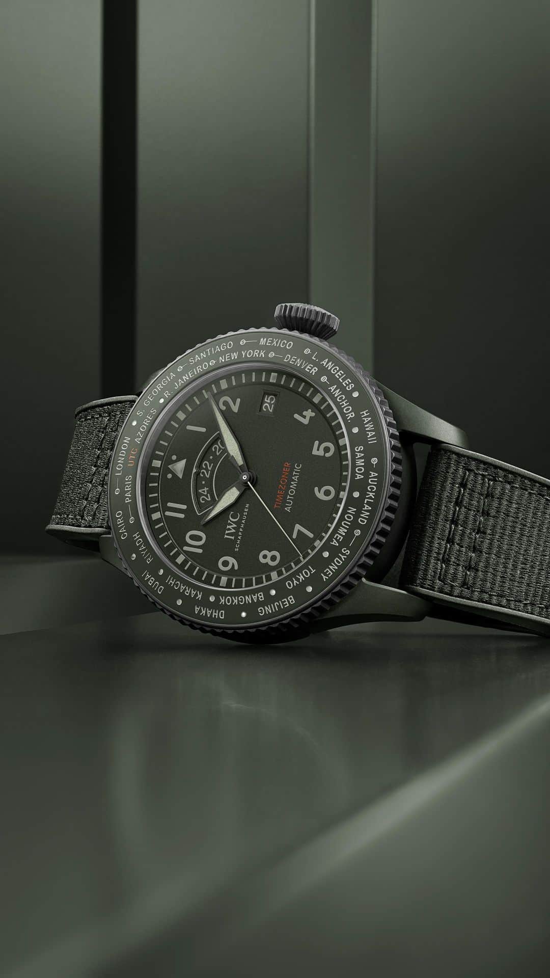 IWCのインスタグラム：「Innovation, engineering and time travelling.  The Pilot’s Watch Timezoner Top Gun Woodland features our patented Timezoner® function, by pressing and rotating the bezel you can choose between one of 24 major cities representing one of the international time zones. All elements composing the timepiece were carefully matched, from the ceramic case, dial and hands to the rubber strap with textile inlay.  #IWCpilot | #IWCtopgun | #IWCwoodland  🔗Link in Bio  ℹ Woodland dial Ceramic/Ceratanium® case 46mm IWC-manufactured 82760 Calibre Ref. IW395601」