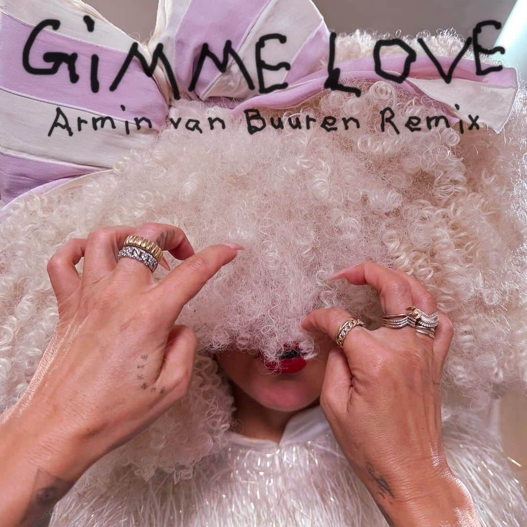 シーアのインスタグラム：「“Gimme Love” is getting the special remix treatment from @arminvanbuuren, out this Friday! 🦄🌈🎧 - Team Sia  [image description: the cover of the Armin van Buuren remix of “Gimme Love” with Sia in a big, white wig and a white + pink bow]」
