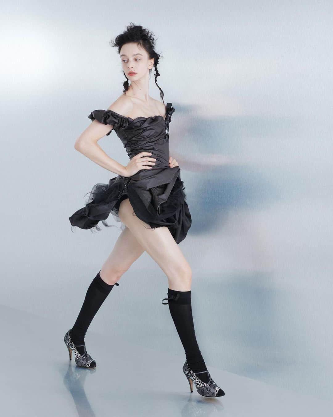 Maison Margielaのインスタグラム：「For the Spring-Summer 2024 Co-Ed Collection, Maison Margiela stages a search for individual truth reflected in the generational adaptation of an inherited wardrobe. Evoking the memory of one age through the radical eyes of the next, Creative Director John Galliano triggers a chemical reaction between eras and attitudes founded in a flashback narrative imagined within the Maison’s ongoing chronicle of the characters Count and Hen.  Look 35. Dark aubergine nylon decortiqué misfit romper with tape detailing. Black silk-cotton knee-high ribbon socks and black suede and textile crystal-encrusted Tabi monster pumps. Model @valentine.charrasse   Look 36. Black coated paper-cotton misfit gown with tape detailing. Black silk-cotton knee-high ribbon socks and silver and black crystal-encrusted Tabi monster pumps. Model @penelope.ternes   Look 38. Black boiled-wool misfit bustier dress with a black taffeta bow. Black silk-cotton knee-high ribbon socks and grey and black suede and textile crystal-encrusted Tabi monster pumps. Model @laurrreyes   Look 39. Black ripstop draped work-in-progress misfit gown. Black silk-cotton knee-high ribbon socks and grey and black suede and textile crystal-encrusted Tabi monster pumps. Model @heconghc   Look 40. Black technical taffeta back-to-front misfit dress. Black silk-cotton knee-high ribbon socks and grey and black suede and textile crystal-encrusted Tabi monster pumps. Model @isitnobis」