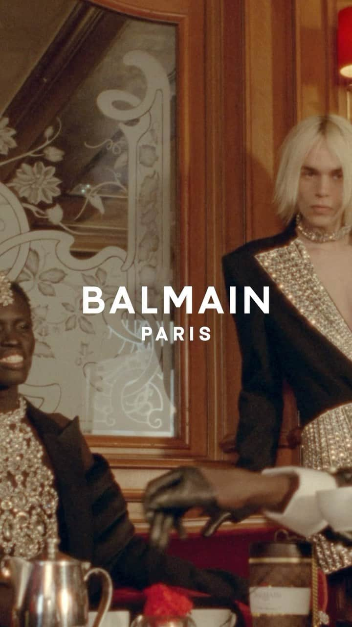 バルマンのインスタグラム：「THE BALMAIN BOYS Un café, s’il vous plaît. Drink in the timeless allure of the capital encapsulated in @olivier_rousteing’s Fall-Winter 2023 menswear collection. #BALMAINFW23  📍 Hotel Regina. Paris.」