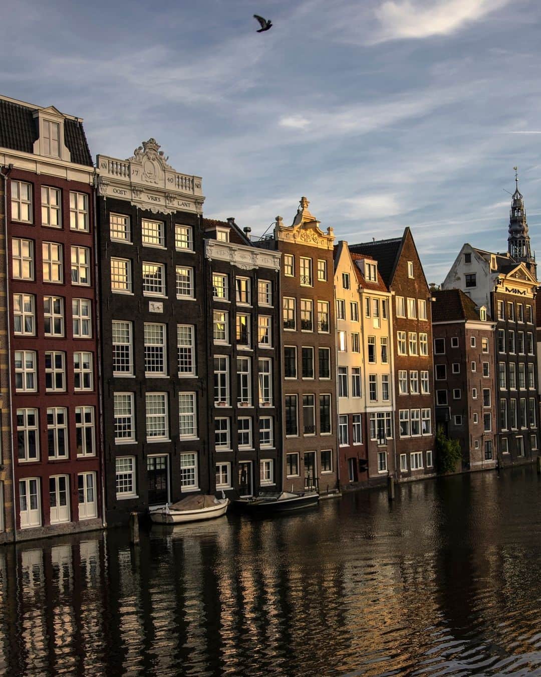 National Geographic Travelのインスタグラム：「Photo by Muhammed Muheisen @mmuheisen | Shortly before the sun sets on a canal in Amsterdam, Netherlands.   For more photos and videos from different parts of the world, follow me @mmuheisen.」