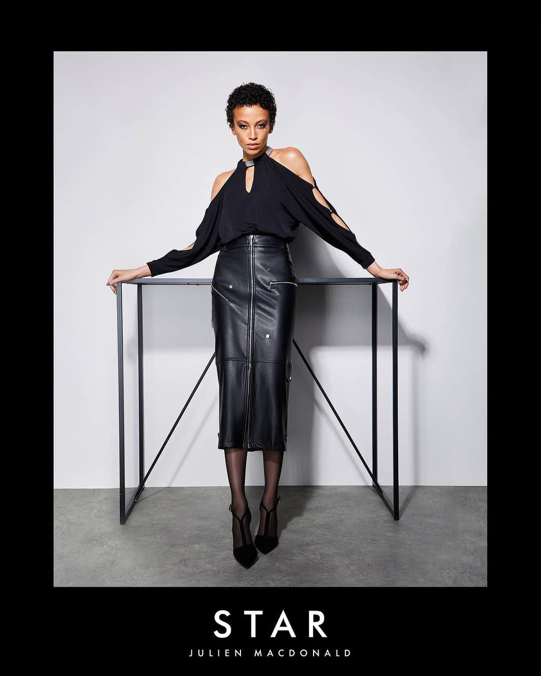 ジュリアンマクドナルドのインスタグラム：「Introducing my exclusive collection STAR by JULIEN MACDONALD.  Offering you my signature designer style at affordable prices.   Black halter neck Swarovski crystal cold shoulder top worn with a black PU zip detail shirt.  Available exclusively online at @freemans   Stay true to your style and feel fabulous this winter, whatever the occasion.」