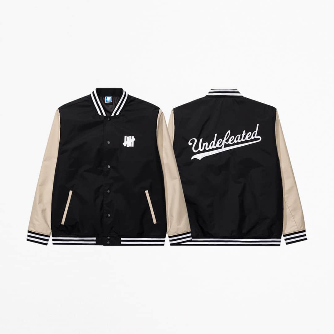 UNDFTDのインスタグラム：「A detailed look into UNDEFEATED FALL 23 - Drop 6  The UNDEFEATED Tech Varsity Jacket, constructed from 100% nylon with water-repellant properties and a filled lightweight taffeta lining, features a ribbed collar, waistband and cuffs, along with a tackle twill appliqué ‘5-strike’ icon on the left side of the chest and collegiate UNDEFEATED wordmark on the back. Available in Black.  Available Friday, 10/20 exclusively at all UNDEFEATED Chapter Stores and Undefeated.com」