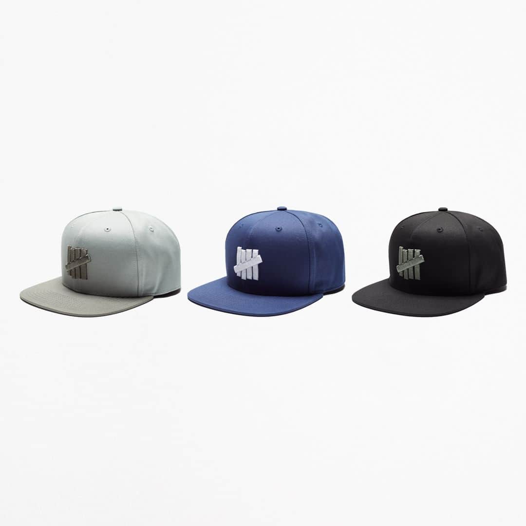 UNDFTDのインスタグラム：「A detailed look into UNDEFEATED FALL 23 - Drop 6  Drop 6 concludes with a collection of headwear, including the UNDEFEATED Icon Snapback, Tech Bucket Hat and Tech Trail Cap. The Icon Snapback is crafted from 100% cotton twill with an adjustable snap and embroidered ‘5-strike’ icon and is available in Admiral Blue, Black and Light Sage. The Tech Bucket Hat is composed of 100% nylon and includes a woven label and an embroidered '5-strike', the Tech Trail Cap is also made of 100% nylon and features an adjustable bungee cord strap and a woven label, both are available in Black.  Available Friday, 10/20 exclusively at all UNDEFEATED Chapter Stores and Undefeated.com」