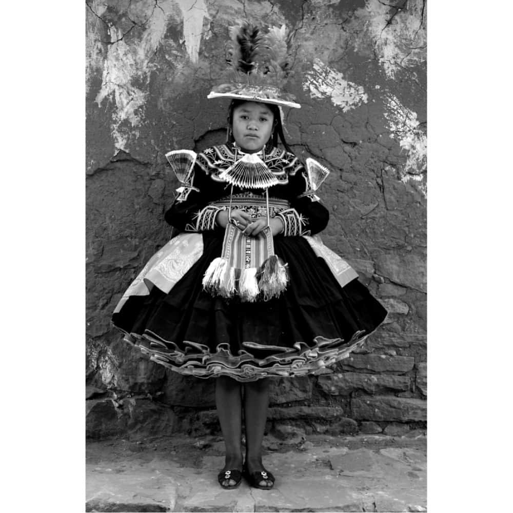 Robert Clarkのインスタグラム：「A young girl on the island of Taquile, the island is in the middle of lake Titicaca, on the Bolivian portion of the lake. She is dressed for a festival. Taquile is a very interesting place, they gave different customs, one being the men stand/sit around all day and knit.   🍃LAST CALL to save 25%!  Thanks for all the support during my 2023 Fall Collector Event! It wraps up at midnight, but please continue to reach out with any questions on sizing, selection, etc.  Code: FALLART  Link in bio.  Pictured: “Soledad Huatta Quispe”」