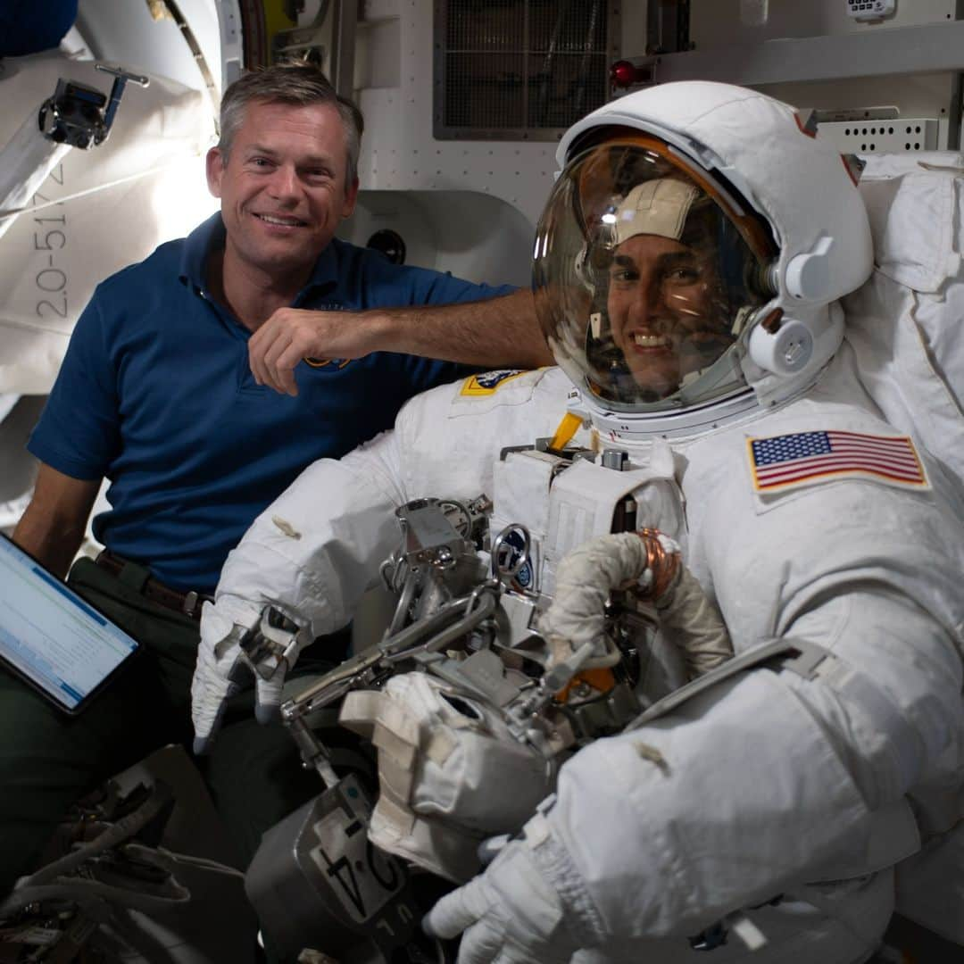 国際宇宙ステーションのインスタグラム：「Expedition 70 Commander Andreas Mogensen from ESA (European Space Agency) assists NASA astronaut Jasmin Moghbeli as she tries on her spacesuit and tests its components aboard the International Space Station's Quest airlock in preparation for an upcoming spacewalk.  Moghbeli and NASA astronaut Loral O’Hara are scheduled for a spacewalk on Oct. 30. The pair will exit the Quest airlock and spend about six-and-a-half hours removing electronics gear and replacing solar array hardware on the orbital lab. Both astronauts have been trying on their spacesuits, testing the suits' components, and organizing tools in preparation for the maintenance spacewalk.  #nasa #esa #astronaut #walk #spacewalk #suit #spacesuit #international #space #station」