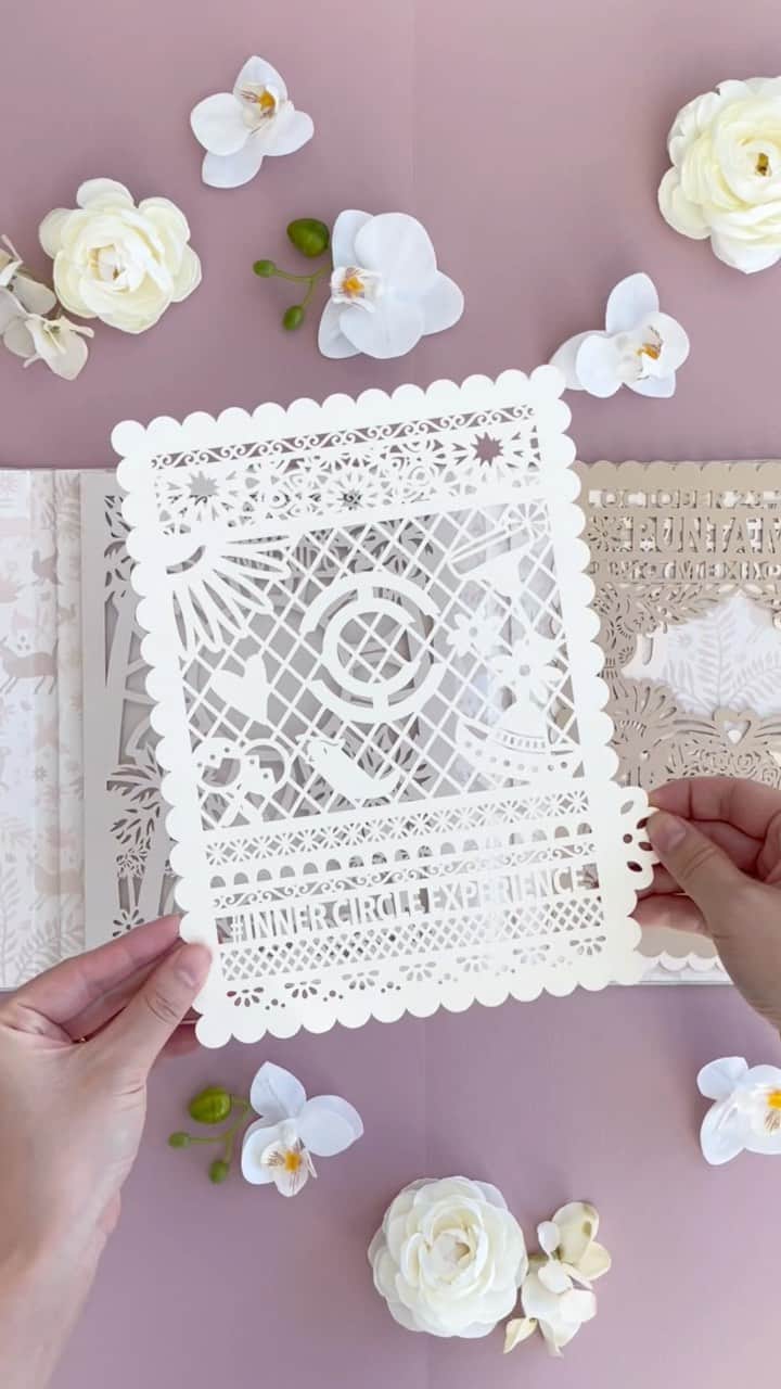 Ceci Johnsonのインスタグラム：「CORPORATE | Introducing our Couture Invitation design for @theinnercircleexperience Mexico 2023.   Inspired by the host hotel @fspuntamita, we chose a calming, neutral color palette symbolizing the warmth and tranquility of the resort, alluding to the luxury the attendees will experience. The invitation features a hand made linen fabric folio, a prelude to the surprise inside. At the heart of this invitation lies a multi dimensional, layered laser-cut paper art. Each panel represents the iconic landscapes and culture of Mexico while incorporating the event text into the Papel Picado artwork. The backdrop showcases the classic Otomi pattern in a soft nude hue, a tribute to the culture of Mexico. #CeciCouture  Stay tuned for more, as we gear up to reveal our exotic menu and accessories from Punta Mita next week! Follow our Founder, @cecijohnson for a behind the scenes updates of the experience.   #cecinewyork #innercircleexperience #coutureinvitations #mexicaninspiration #luxuryinvitations #otomipattern #luxuryevents」