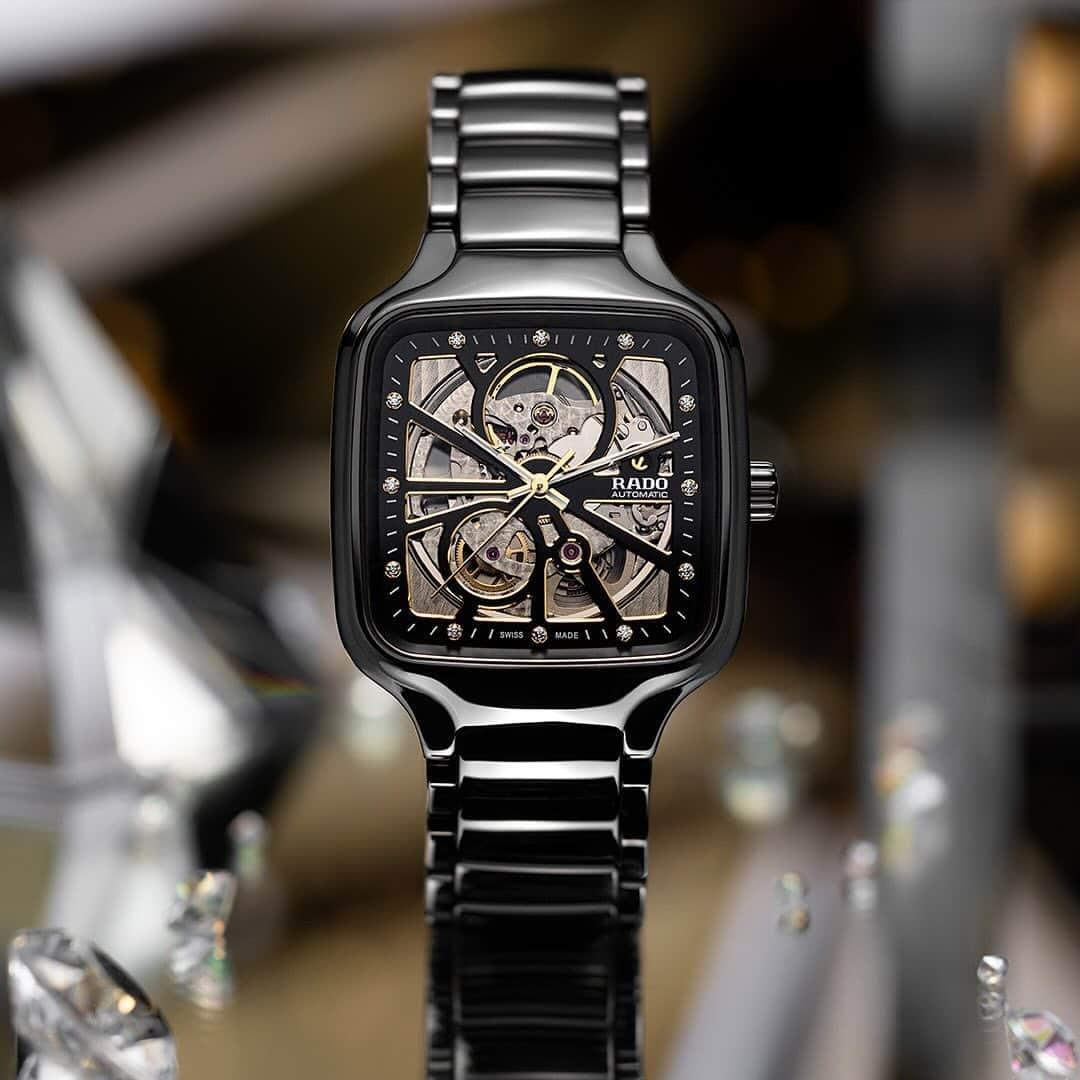 ラドーのインスタグラム：「A true square beauty.​ Rado expands its True Square Open Heart collection with hues of sophistication in a polished black high-tech ceramic case. With shimmering diamond hour markers, its titanium case back offers sapphire crystal viewing, and the lightweight, smooth ceramic feel that is unique to Rado. ​  #Rado #RadoTrueSquare #CeramicWatch #SquareWatch #DiamondWatch #Feelit」