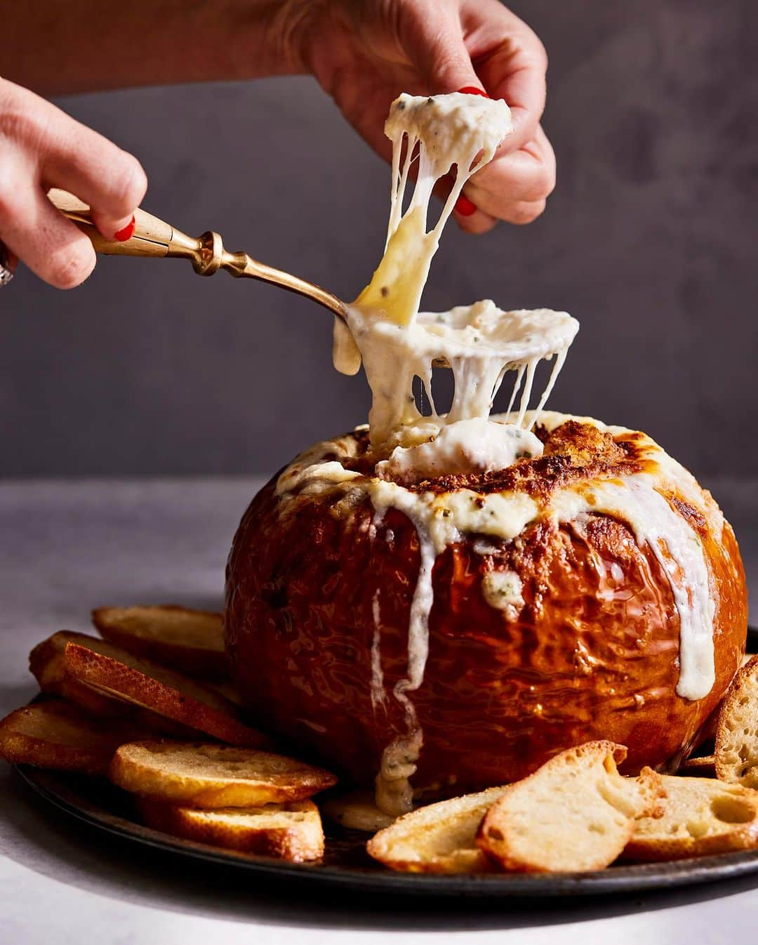 Gaby Dalkinのインスタグラム：「Forever my favorite show stopper on Halloween… Pumpkin Fondue! Will never forget how fast me @mattarmendariz and @adamfoodstyle demolished this 🎃 recipe linked in my bio https://whatsgabycooking.com/pumpkin-fondue/」