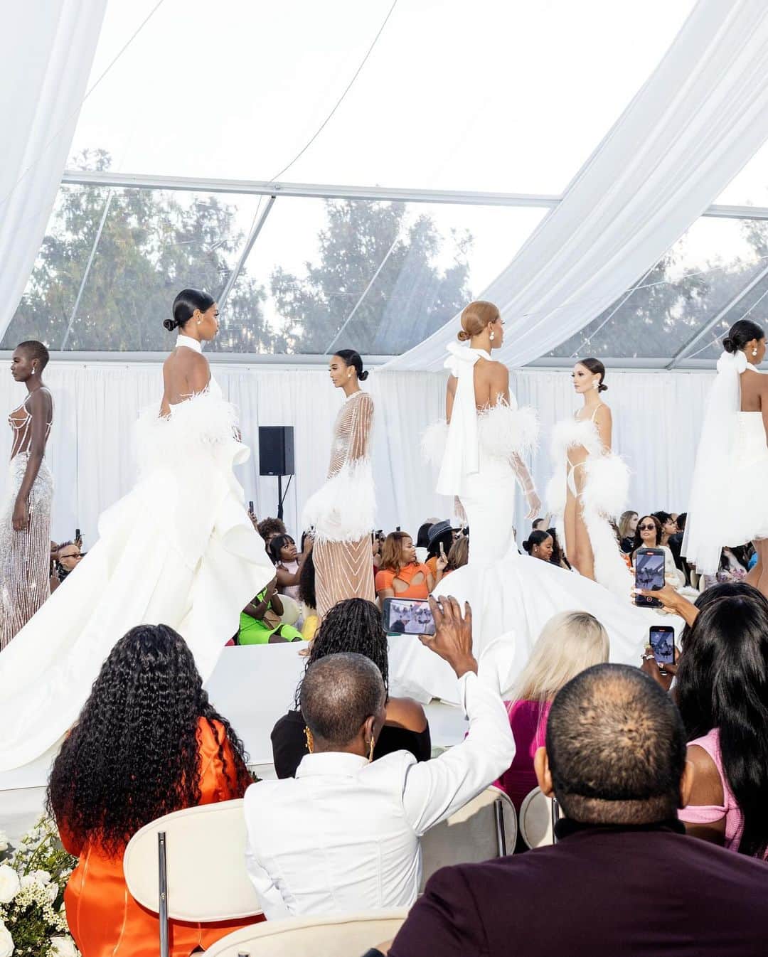 New York Times Fashionさんのインスタグラム写真 - (New York Times FashionInstagram)「Anifa Mvuemba, the founder of the clothing brand Hanifa, presented her first bridal collection, inspired by a luxury wedding complete with a cocktail hour and after-party in Middleburg, Virginia.  @hanifaofficial has a fervent fan base, loyal to Mvuemba’s vibrant dresses and knitwear. Now, Mvuemba is expanding into the bridal space, inadvertently closing Bridal Fashion Week, which took place Oct. 10-12 in New York. She presented her debut collection outdoors at the Salamander Resort and Spa, a Black-owned, women-owned luxury resort.  The event was set up like a wedding, all that was missing was a ring exchange. Women in matching pink custom Hanifa jumpsuits greeted guests, many of whom were dressed in cocktail attire from Hanifa’s previous collections.  See more from the show at the link in our bio. Photos by @jasoncandrew」10月23日 3時54分 - nytstyle