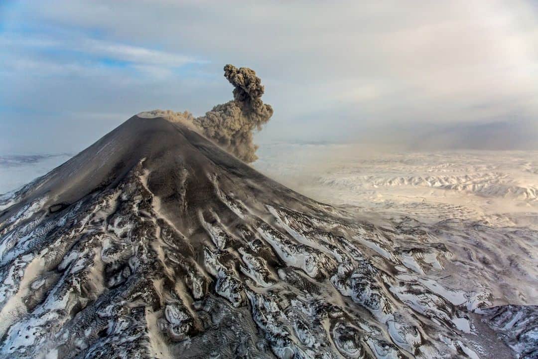 CANON USAのインスタグラム：「Incredible shot by #CanonExplorerOfLight @jimmychin: "Land before time. Kamchatka Russia has the highest density of active volcanoes anywhere in the world. Lucky to catch this one as it was erupting."  📸  #Canon EOS 5D Mark III Lens: EF 24-70mm f/2.8L II USM」