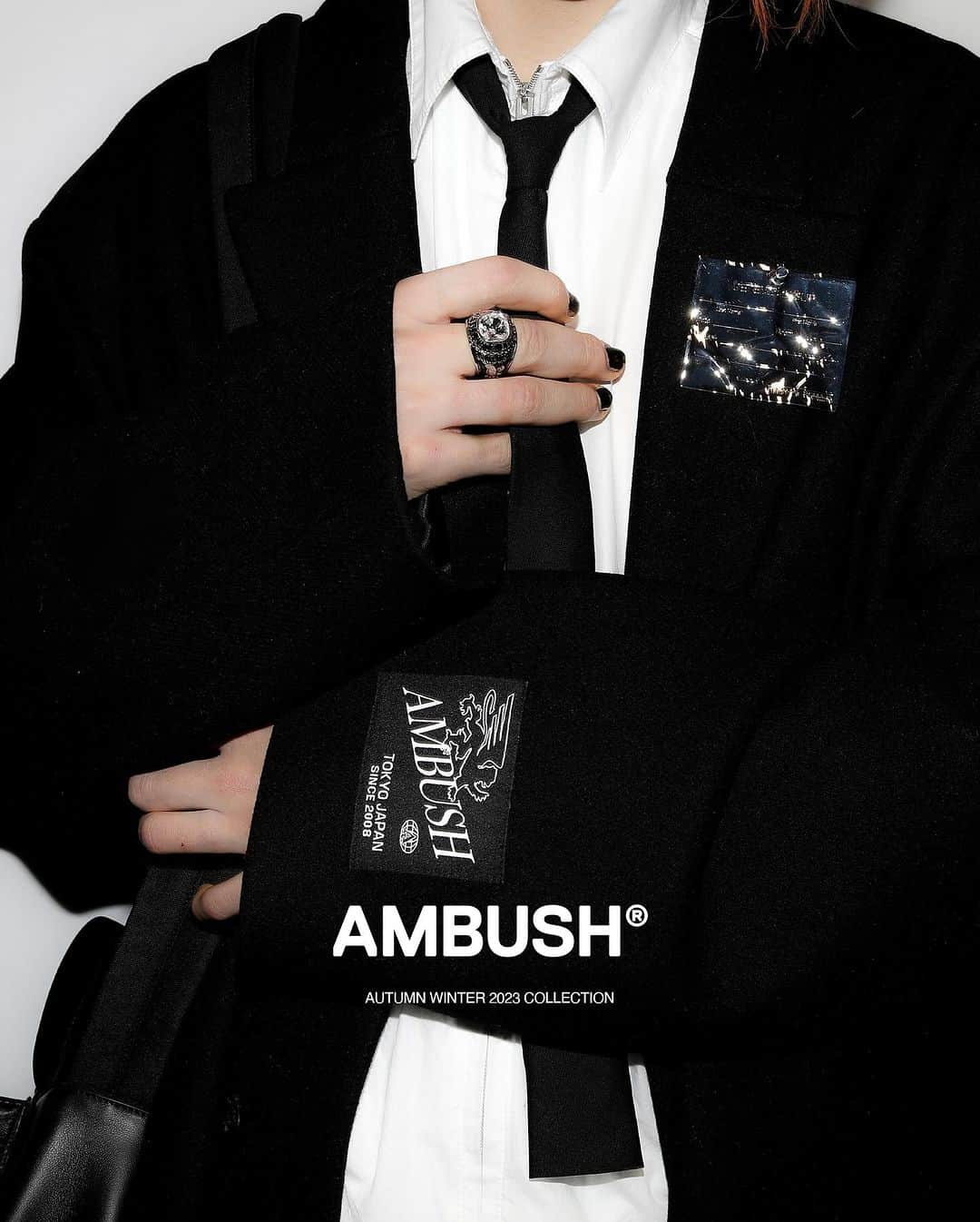 AMBUSHのインスタグラム：「The new #AMBUSH collection is a nod to classic tailoring, where suit jackets and coats are labeled with the tailor's name.   Although typically removed, the AMBUSH label subverts tradition by stitching the label as a permanent patch.  Find this and other items now at our WEBSHOP and WORKSHOP」