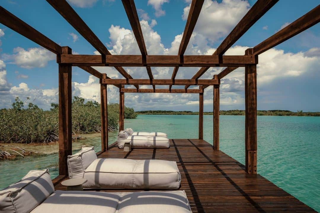 Wallpaperさんのインスタグラム写真 - (WallpaperInstagram)「The new @bocadeagua hotel overlooks the crystal clear waters of Lake Bacalar in Mexico’s Yucatan Peninsula. Designed by architect @fridaescobedo, the low-density hospitality destination aims to make a positive impact on its environment. ⁠ ⁠ It comprises a series of spacious and carefully crafted jungle tree houses, made from local FSC certified tropical hardwood and elevated from the ground to minimise their impact and footprint on the site. Over 90 per cent of the 82 acres plot remains untouched and will be part of a conservation programme.⁠ ⁠ 🖊: Ellie Stathaki⁠ ⁠ #wallpapermagazine #bocadeagua #mexico #hotel #mexicanarchitecture #mexicanhotel #fridaescobedo #hospitality #sustainabledesign #yucatan⁠」10月24日 17時00分 - wallpapermag