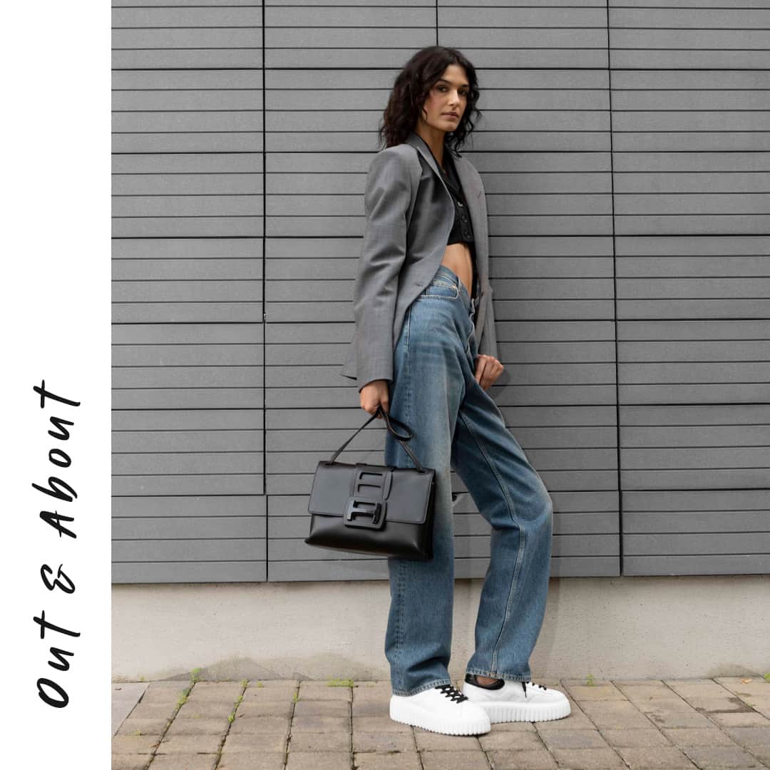 のインスタグラム：「Effortless style meets functionality with @elda.scarnecchia in the #HOGAN H-Stripes #sneakers and H-Bag⁣ #GenH ⁣ Discover more via link in bio」