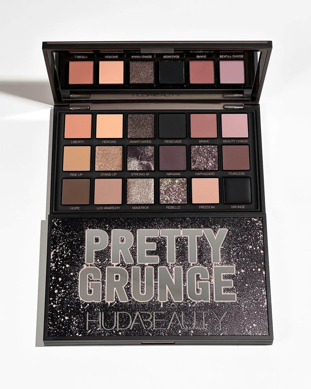 Huda Kattanのインスタグラム：「Unleash your inner HEROine with our NEW Pretty Grunge Palette! Each shade tells a story of empowerment, from 'STAND UP' and 'HOPE' to 'RISE UP' and 'FREEDOM,' let this palette inspire the strength within you.  This palette is a statement to remind you of what you're truly capable of, & with its versatile, intensely pigmented, & unapologetically bold shades, you can rise up, redefine beauty, & let your true colors shine. 💥🖤  Meet the #PrettyGrunge Collection: 🎨 #PrettyGrunge palette with 18 pretty-to-grunge shades  🌟 Limited-edition Blush Gloss that adjusts to your skin pH  🖤 Limited-edition ‘black’ shades in Liquid Matte Lipstick, Silk Balm & Lip Contour 2.0  💄 Lip Quad with x4 travel-sized Liquid Matte Lipsticks in nude shades, including our BEST-SELLING shade, Bombshell.   🌍 AVAILABLE GLOBALLY NOV 1ST 🌎 #PrettyGrunge」