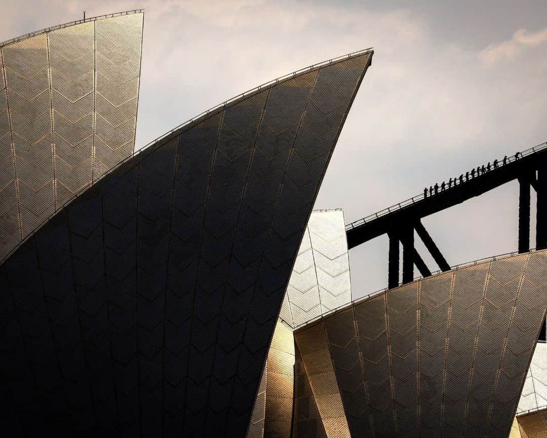 AFP通信のインスタグラム：「Tourists climb the Sydney Harbour Bridge behind the Sydney Opera House.⁣ ⁣ 📷 David GRAY #AFP」