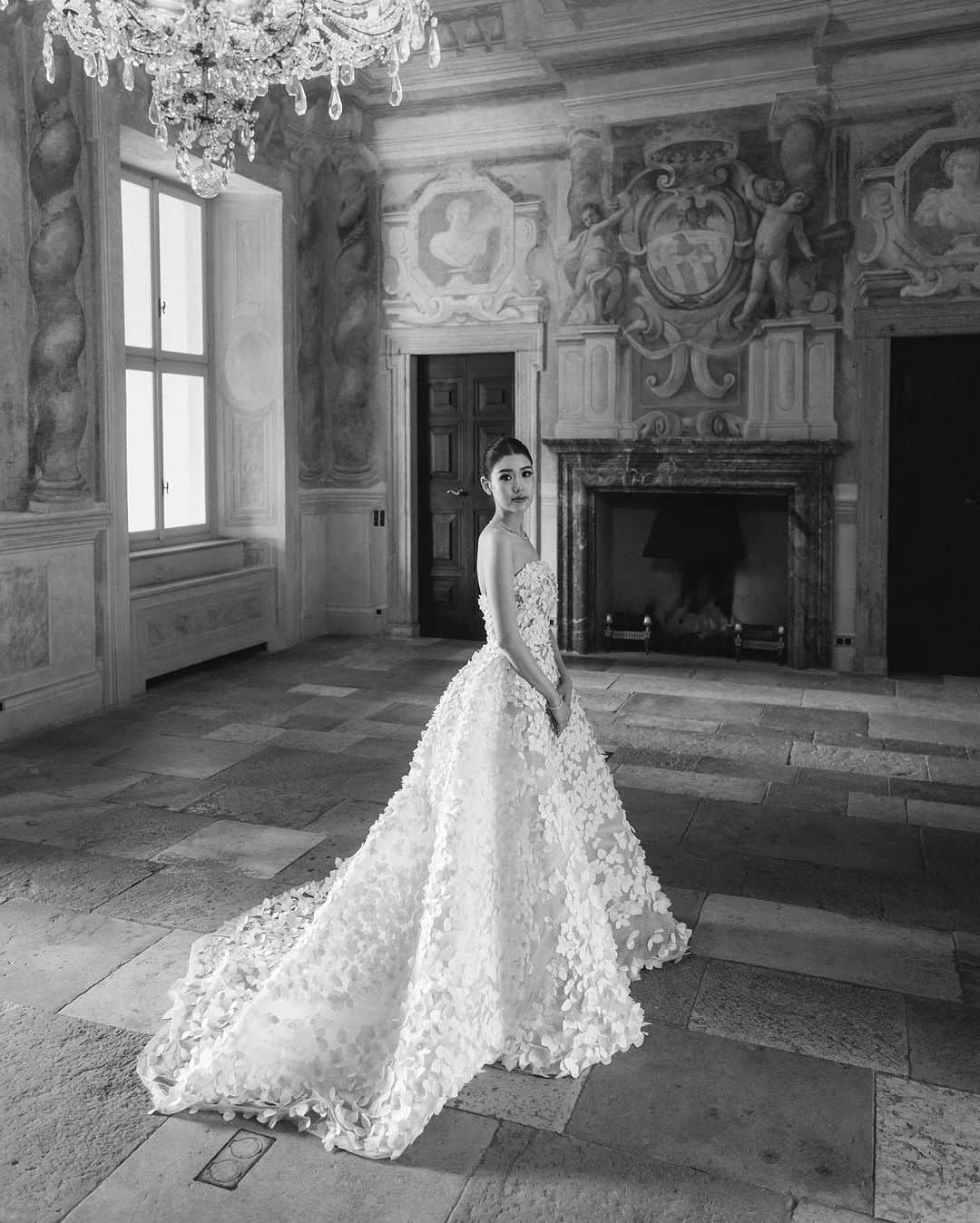 オスカーデラレンタのインスタグラム：「A statement of storybook romance, the #odlrbridal micro sequin and petal appliqué ballgown exudes delicate beauty. Bride @brynawang stuns in the gown for her dreamy nuptials.  Photographed by @davidsalim」