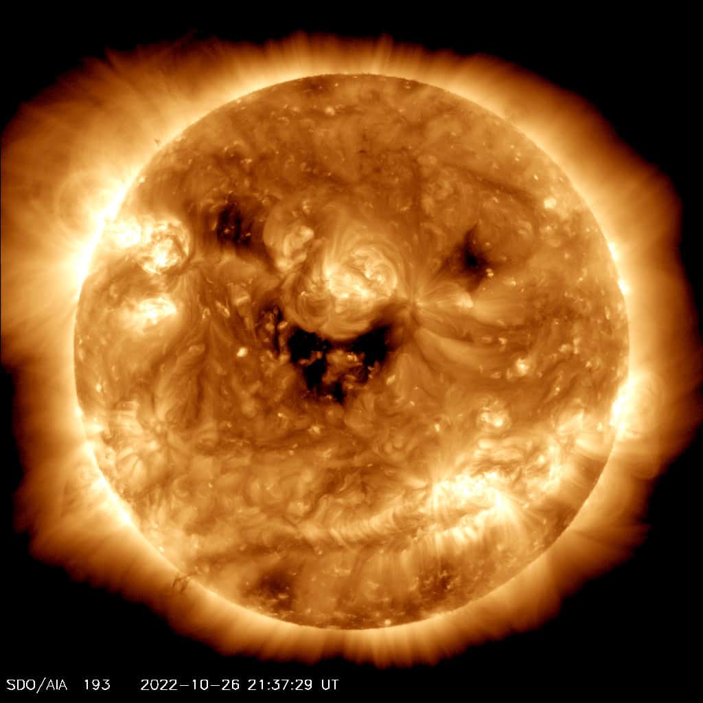 NASAのインスタグラム：「You're amazing and make all our days brighter. ☀️ And the same goes for our favorite star, the Sun!  @NASASun's fleet of missions helps us learn all we can about our Sun, including capturing images like this happy Sun snapshot from the Solar Dynamics Observatory (SDO). See what SDO sees today by checking out its latest images - and remember to keep on shining!  https://go.nasa.gov/47ieNg1  Image Description: An image of the Sun captured by NASA's Solar Dynamics Observatory spacecraft. The Sun looks like a large, glowing, gold sphere with soft white rays surrounding it, and swirls of dark gold to white-gold across its surface. The image shows areas of high activity in black, and these black features seem to form a smiling happy face amid the fiery glow of the star.」