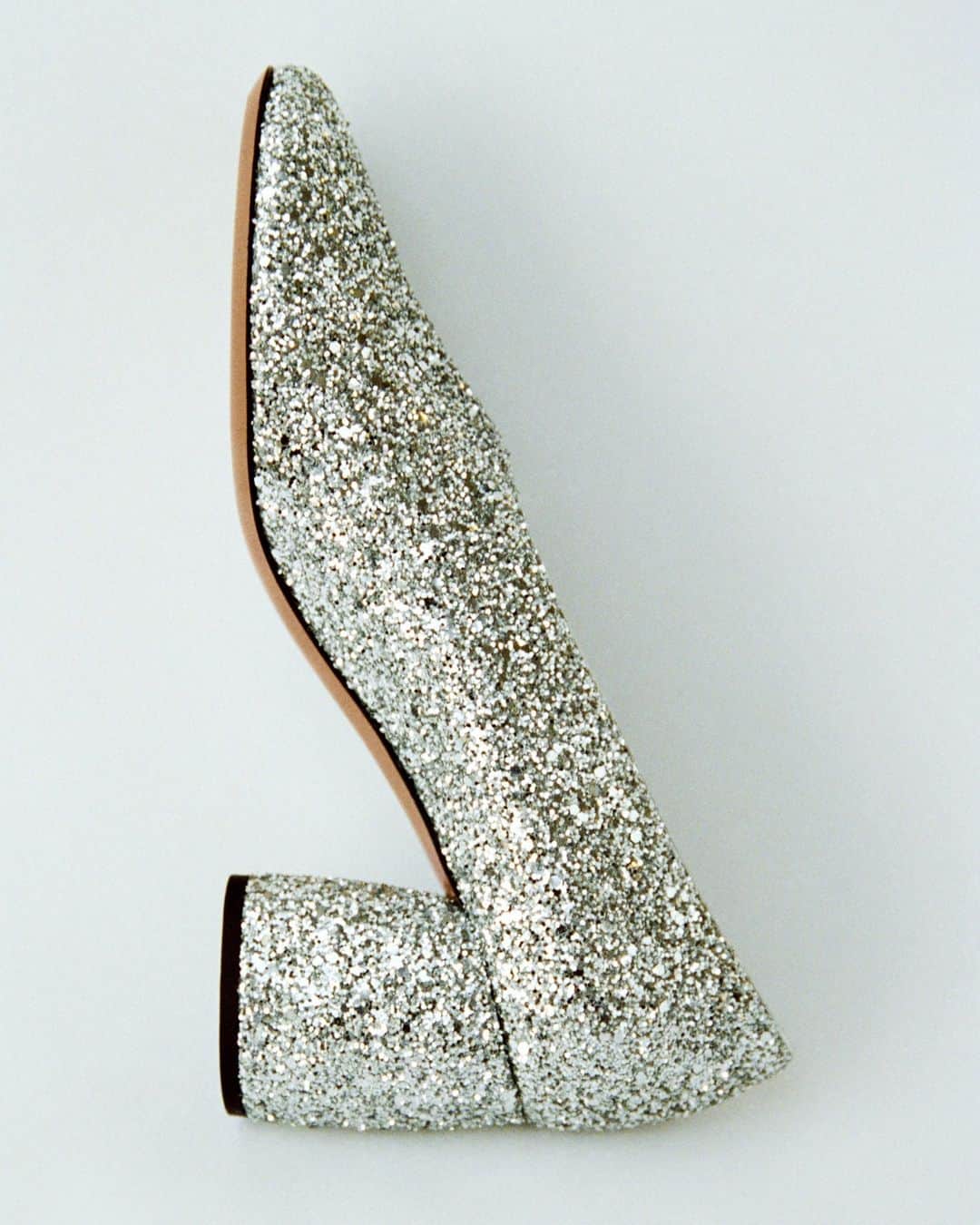 ARKETのインスタグラム：「Glitter pumps with high topline and sculptured block heels. Silver-toned leather inside. Heel height 6 cm. Explore all of our seasonal footwear: link in bio. - #ARKET」
