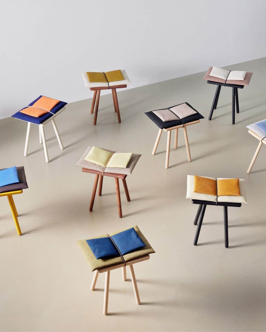 フリッツハンセンのインスタグラム：「For Georg Stool’s 10th anniversary, designer @chrisliljehal has extended her creative vision and created ten unique Georg Stools:⁠ ⁠ “I have made ten quite different versions, some are more quiet, others louder in their expression. I wanted to show the possibilities in the design.” – @chrisliljehal  ⁠ A double cushion concept leans into the designer’s observation that people are often drawn to lifting Georg’s cushion in a playful manner. ⁠ ⁠ These ten original stools will be exhibited and go on sale at the Fritz Hansen Store in Copenhagen from 22nd November at 5 PM to December 6 with all proceeds going to charities selected by the designer. ⁠ Learn more about the designer and the Georg Series⁠  Textile supplied by @kvadrattextiles」