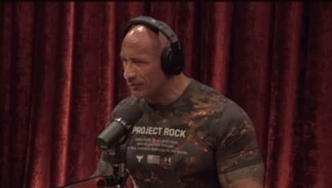 ドウェイン・ジョンソンのインスタグラム：「Chopping it up with @joerogan about the summer of ‘97 before I became “The Rock”, my name was “Rocky Maivia” - I just tore a ligament in my knee and my @wwe career was completely failing as a rookie babyface. I started to consider a career in MMA with a new started fighting company, called PRIDE in Japan — where the athletes were making some pretty big money.   I thought I could take a year or so to commit to my MMA training and maybe I’d have shot. Maybe not.  But I wanted to make some real money.   At the end of that summer of ‘97 I was rehabbing my injured knee and got the call from Vince McMahon that wound up changing my life — he said I’m gonna bring you back BUT you’re gonna become a heel, join the Nation of Domination and call yourself The Rock.   Thank God I got that call, because my career as an MMA fighter in PRIDE would’ve lasted all of 3 minutes because those guys would’ve knocked my fucking jaw across the pacific 😂💀  But the lesson of all this that I did learn, is that the most powerful thing you can be is yourself.」