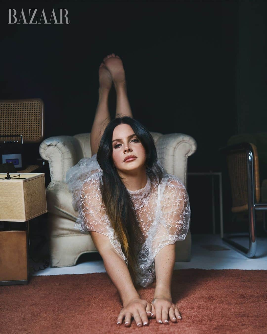 Harper's BAZAARさんのインスタグラム写真 - (Harper's BAZAARInstagram)「Lana Del Rey (@honeymoon), born Elizabeth Woolridge Grant, first released music under her own name, as Lizzy Grant. But when that failed to chart, she chose a stage name and a new look—one that pulled from the iconography of doomed beauty, a pastiche of pinup bombshell and gangster’s girlfriend. She was Marilyn Monroe, Lana Turner, Priscilla Presley, Karen Black in Easy Rider. Her videos were a collage of images signaling the American dream gone wrong: blinking neon, leaves in the swimming pools, death and love and sex displayed before the flag. Was it one reference too many? Stage names, symbolism, and reinvention are nothing new to music. Yet in Del Rey’s case, some people felt inexplicably tricked.  So, who is she *really?* The singer and songwriter opens up in BAZAAR’s December/January 2024 Art Issue. Keep reading the cover story at the link in bio. — December/January 2024 Art Issue  Photographer: @collierschorrstudio Stylist: @yashuasimmons Creative Director: @lauragenninger Story by: @chloecooperjones Hair: @annacofone for @authenticbeautyconcept Makeup: @etienneortega for @milkmakeup Manicure: @nailsbyemikudo for @diorbeauty Entertainment Director: @angcutt Production: Day International Set design: @maximjezek」11月21日 22時03分 - harpersbazaarus