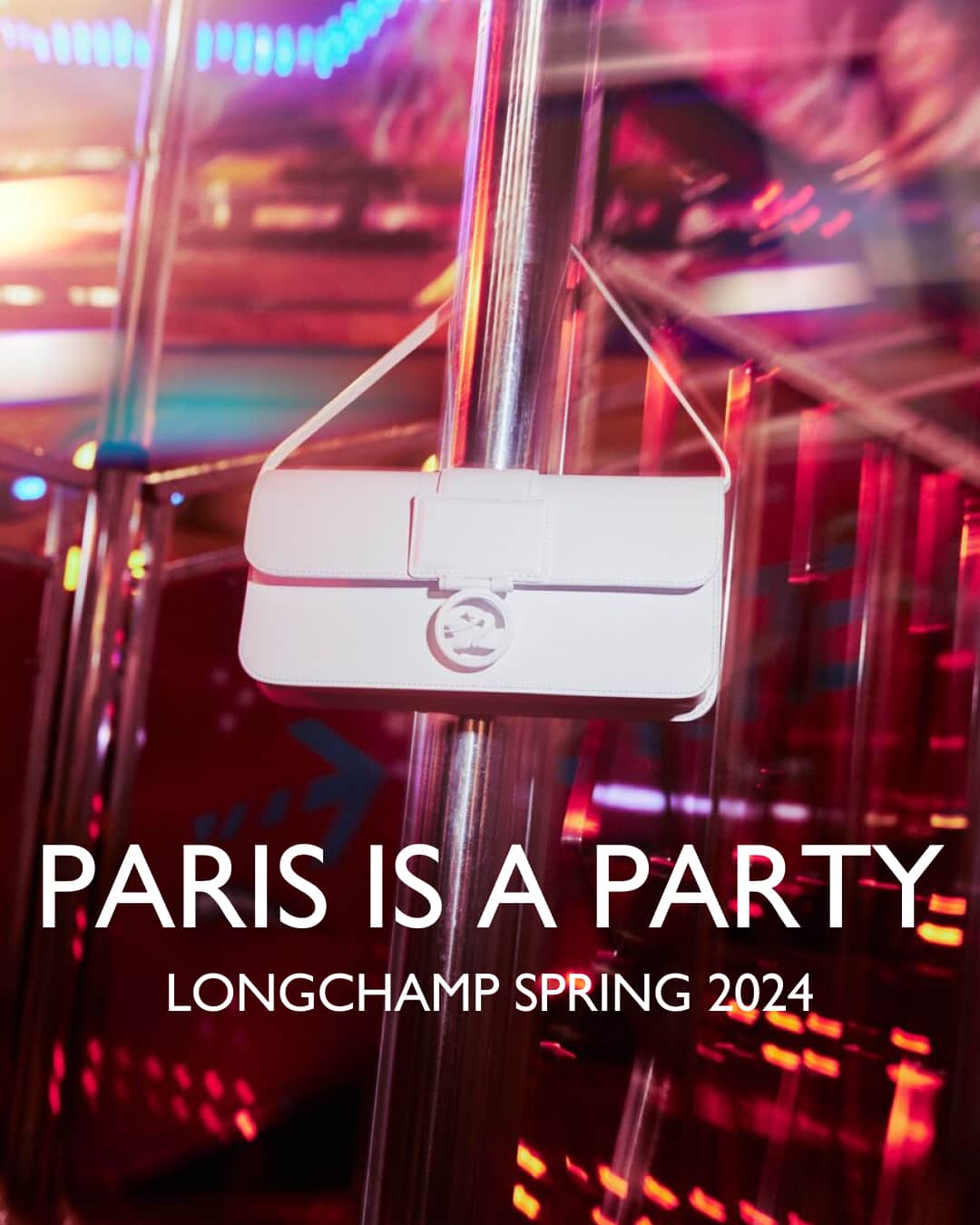 Longchampのインスタグラム：「Let's celebrate the city of lights.  Collection: #ParisIsAParty  Bag: #LongchampBoxTrot   Photographer: @guillaumesanner   #ParisIsAParty #endoftheyear #newcollection #longchamp #LongchampSS24 #christmas #christmasoutfit #newyear2024 #newyearoutfit #party #partyvibes #whitebag #leatherbag #longchampbag」