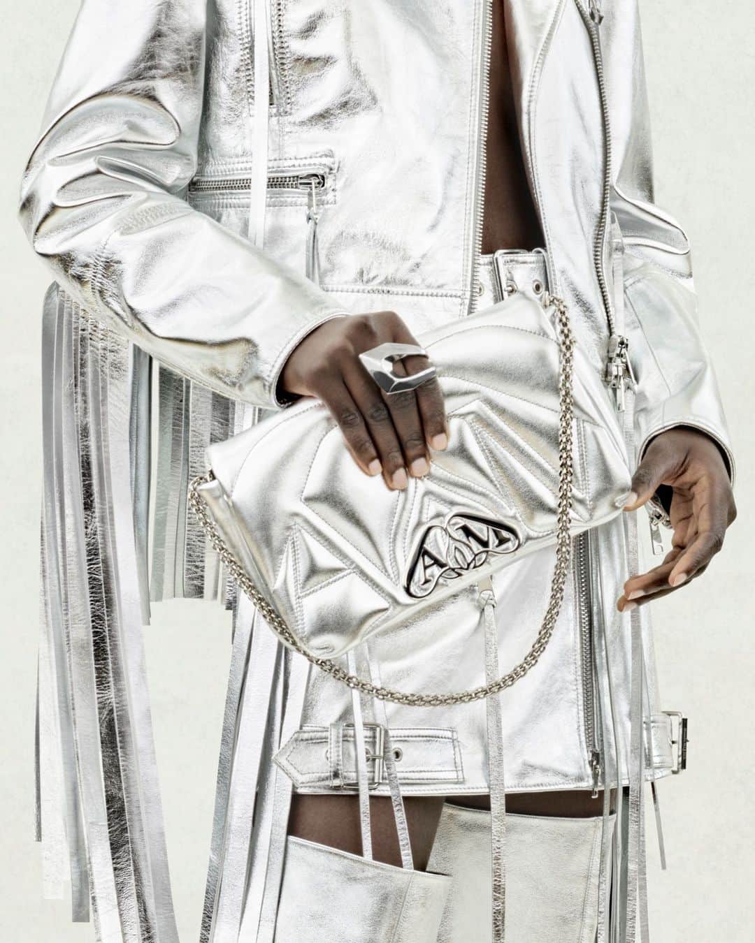 アレキサンダー・マックイーンのインスタグラム：「The new #McQueenSeal bag in silver for #McQueenPreSS24.⁣ ⁣ Discover the collection via the link in bio.⁣ ⁣ Photographed by @Jet.Swan」