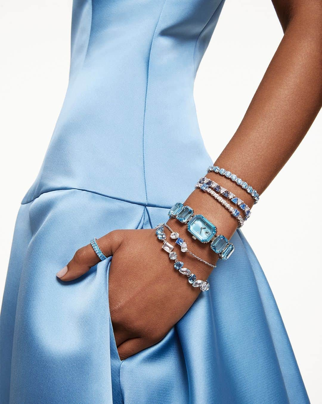 SWAROVSKIのインスタグラム：「Bring on the blues this Holiday season with the ice-cool colors of #SwarovskiMatrix, #SwarovskiOrtyx, #SwarovskiMesmera, and #SwarovskiGema bracelets styled with the #SwarovskiMillenia-inspired watch and #SwarovskiMatrix ring. Celebrate Wonder your way.   #Swarovski #CelebrateWonder #CrystalMetamorphosis​​」