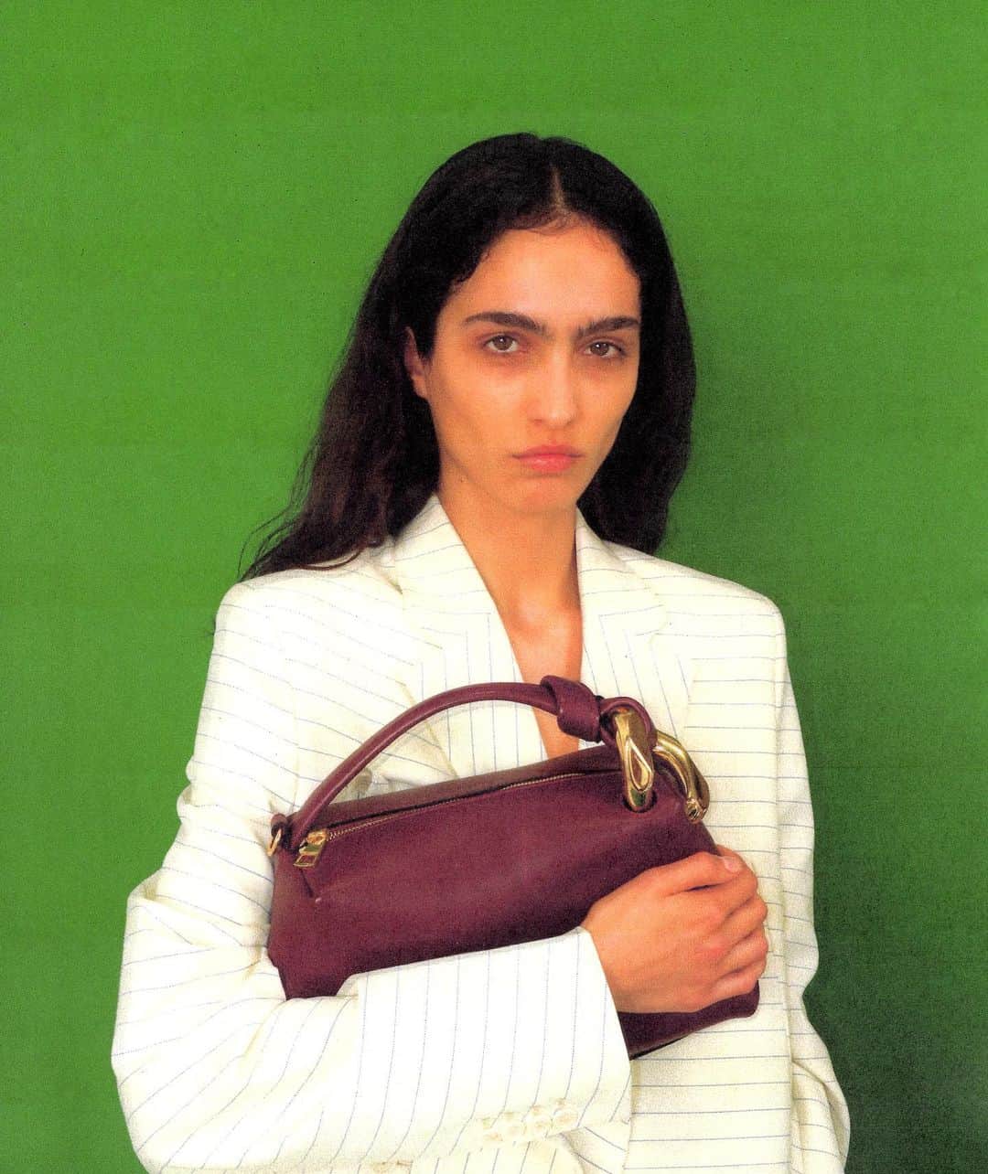 JWアンダーソンのインスタグラム：「IT’S HOLS SEASON  Sara wears the Panelled Blazer and the Corner Bag  Nathaniël wears the Anchor Logo Tank Top and the P***s Stud Earring   Creative direction @Jonathan.Anderson Photography @JoeCruzStudio  Set Design @rorywmullen  Hair @tommystayton  Make Up @annesophiecosta   #jwanderson #happyhols」