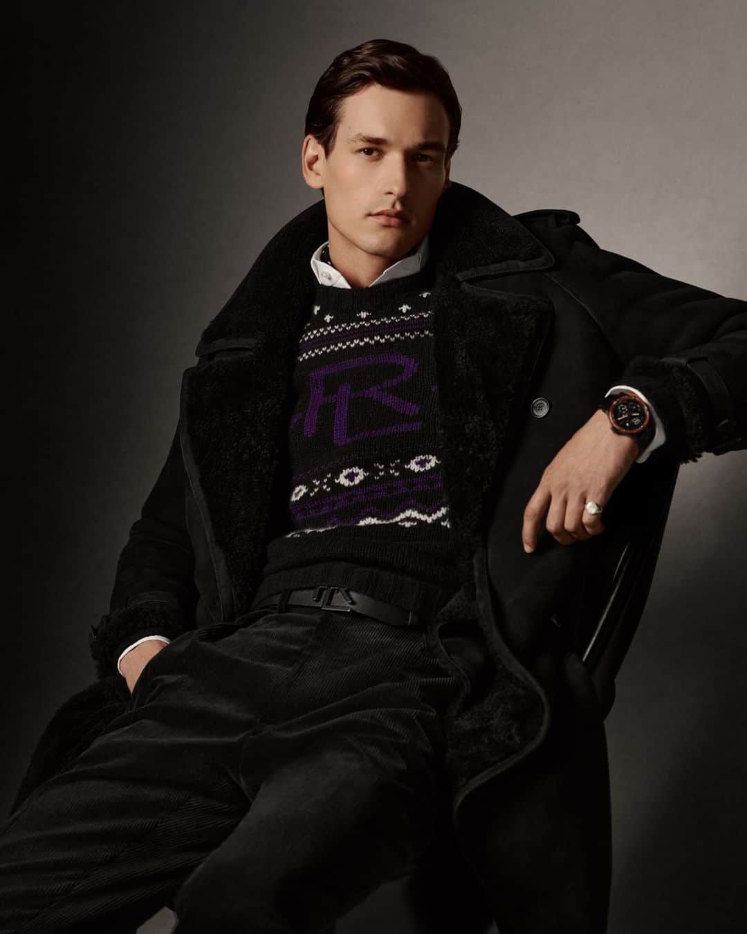 Ralph Laurenのインスタグラム：「#RLHoliday details, like intarsia-knit motifs, add texture to #RalphLauren’s iconic cashmere sweater. Here, the silhouette is styled with a black overcoat and an Automotive collection timepiece.  Discover the #RLPurpleLabel Hand-Knit Patterned Cashmere Sweater and watches via the link in bio.」