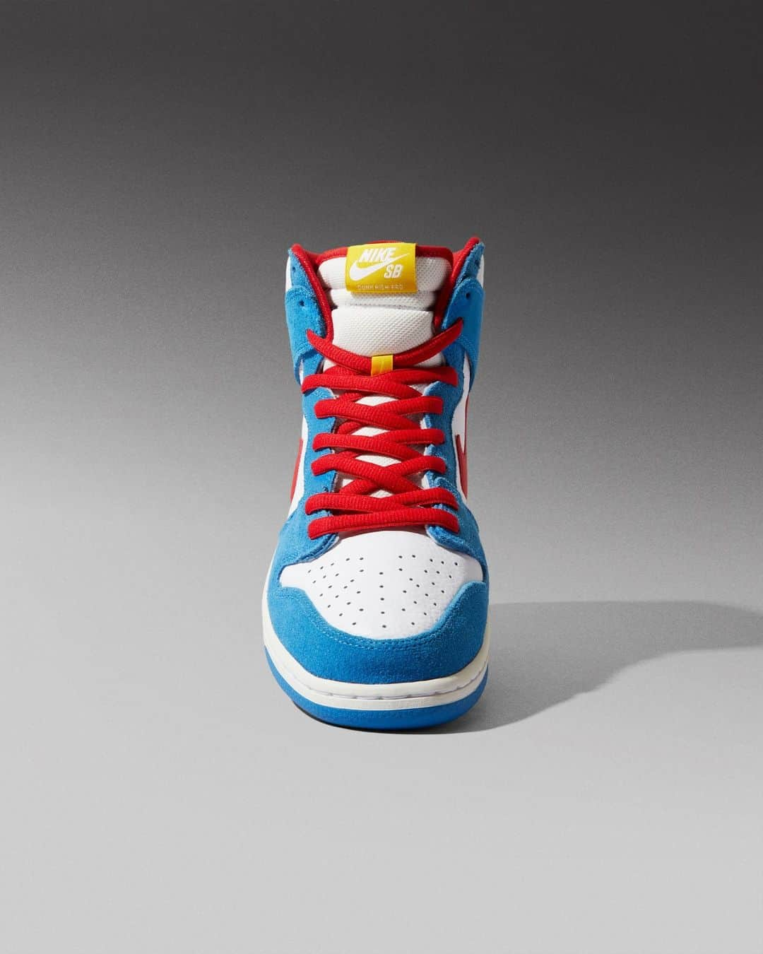 Flight Clubのインスタグラム：「Japan's iconic time-traveling cat takes form on the Dunk High SB 'Doraemon.' Inspired by the 1970s manga and animated series, the high-top SB takes on a fresh white leather upper with vibrant hits of Speed Red and Photo Blue suede. A pop of yellow from Doraemon's bell lands subtly on the vintage Nike tongue tag.」