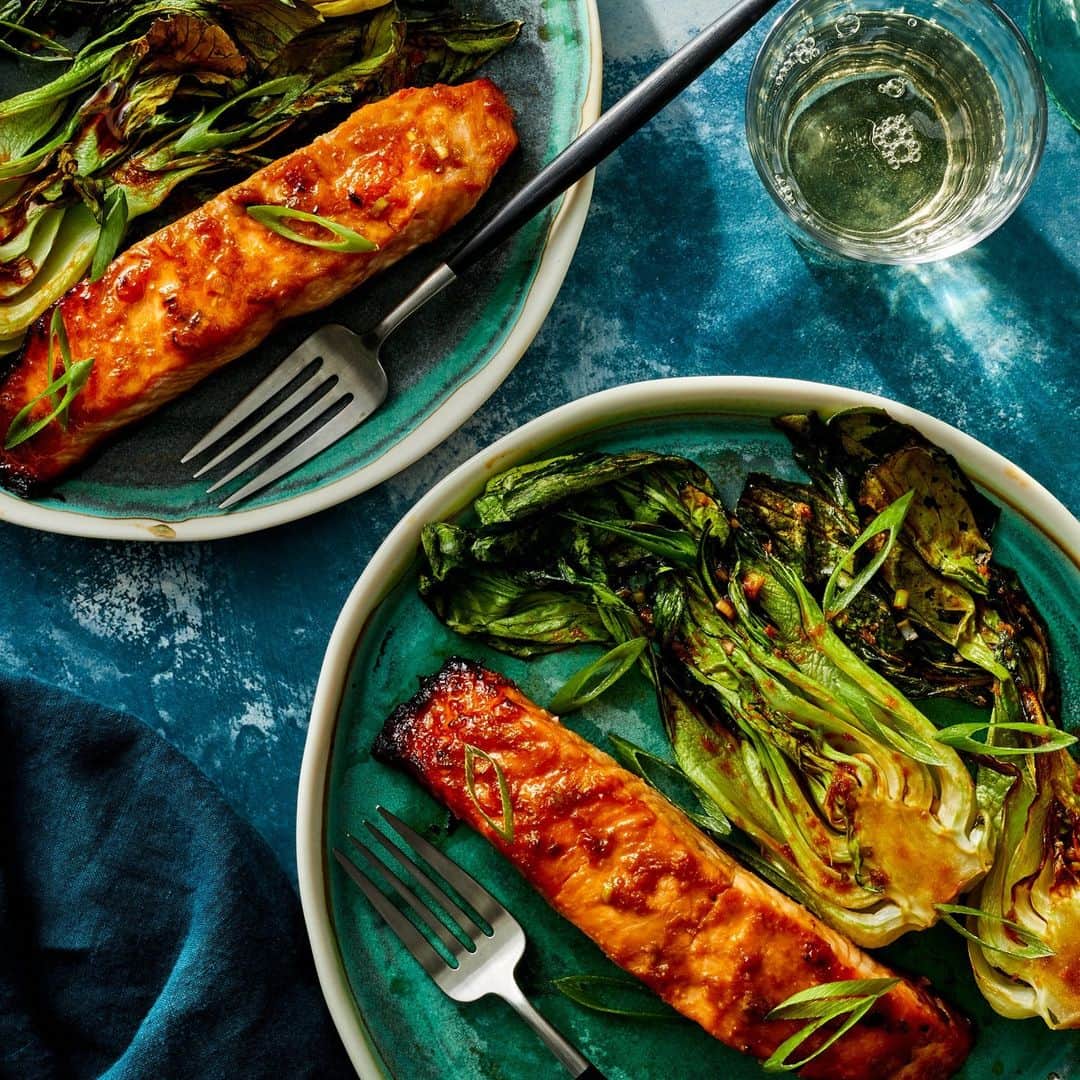 Food & Wineのインスタグラム：「When we want a lot of flavor quickly, miso is almost always the answer. A simple marinade made with soy sauce, ginger, miso, and mirin packs a punch in this air fryer salmon recipe, which will be on your table alongside some crisp-tender bok choy in just 45 minutes. Make it at the link in bio!   🐟: @jazzy_the_princess, 📸: @antonisachilleos, 🥄: Ruth Blackburn, 🍽: @cspollen」
