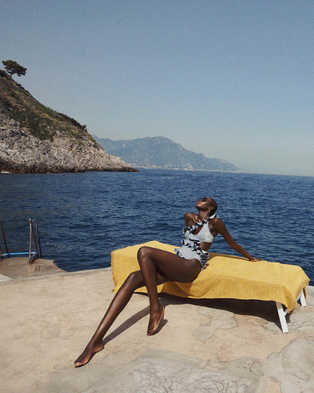 のインスタグラム：「Chasing the Sun: The August Asymmetric Frill 1PC captured for Resort Swim 24 in Capo di Conca, Italy. Explore new season Swim in stores and online. #ZimResortSwim24 #zimmermann」