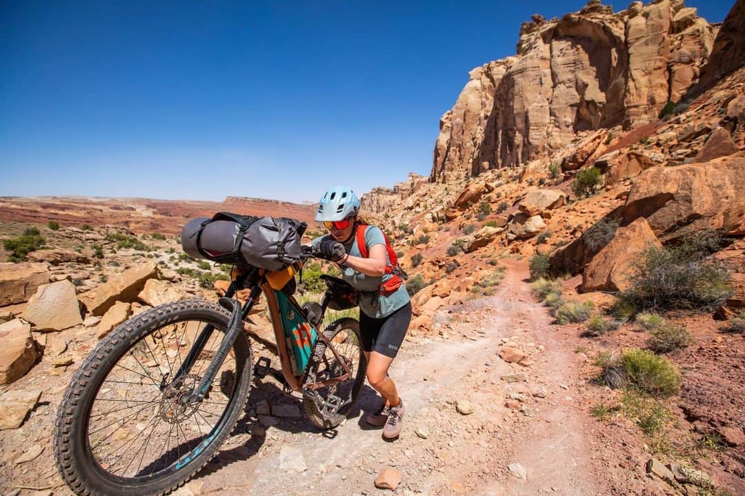 National Geographic Travelのインスタグラム：「Photo by @sofia_jaramillo5 | A mountain biker pushes her bike up a particularly steep section of trail during a bikepacking trip in Utah’s San Rafael Swell. For three days we biked along this distinct geological area permeated by sharp, sudden upthrusts of rock that formed 40 to 70 million years ago. Geologic features from the Permian to Cretaceous periods, native endangered plants like the San Rafael cactus, and Native American pictographs and petroglyphs can all be seen in this unique area.   For more biking images from around the world, follow @sofia_jaramillo5.」