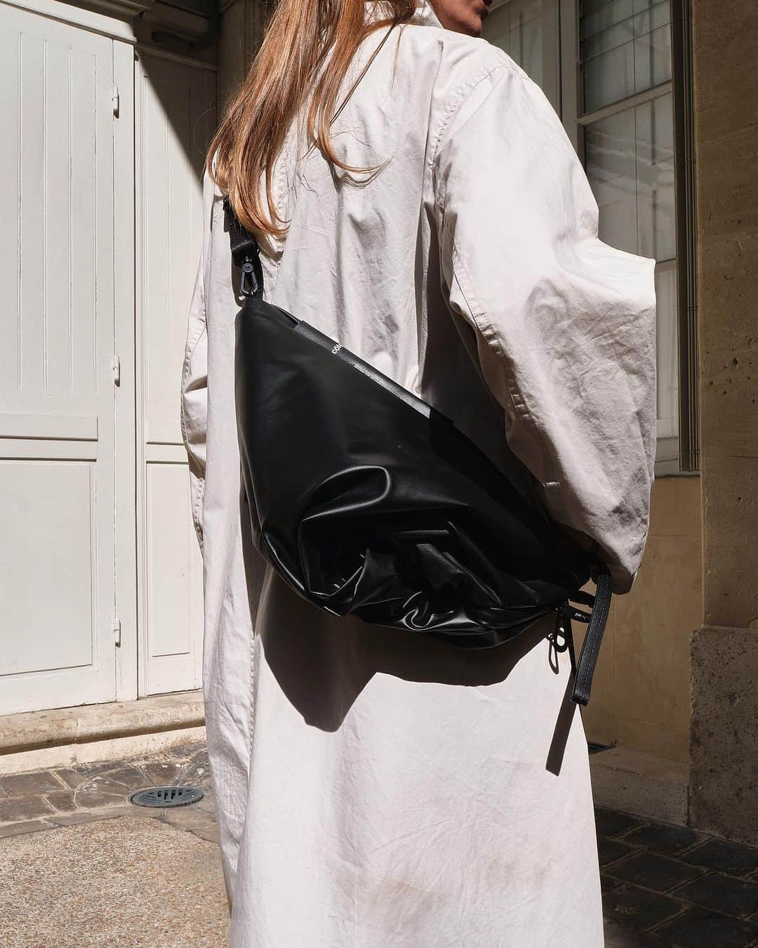 のインスタグラム：「The ORNE “Raven” can be worn in a number of ways that interact with the silhouette of your body to work in unison with you.  Available to purchase from www.coteetciel.com」