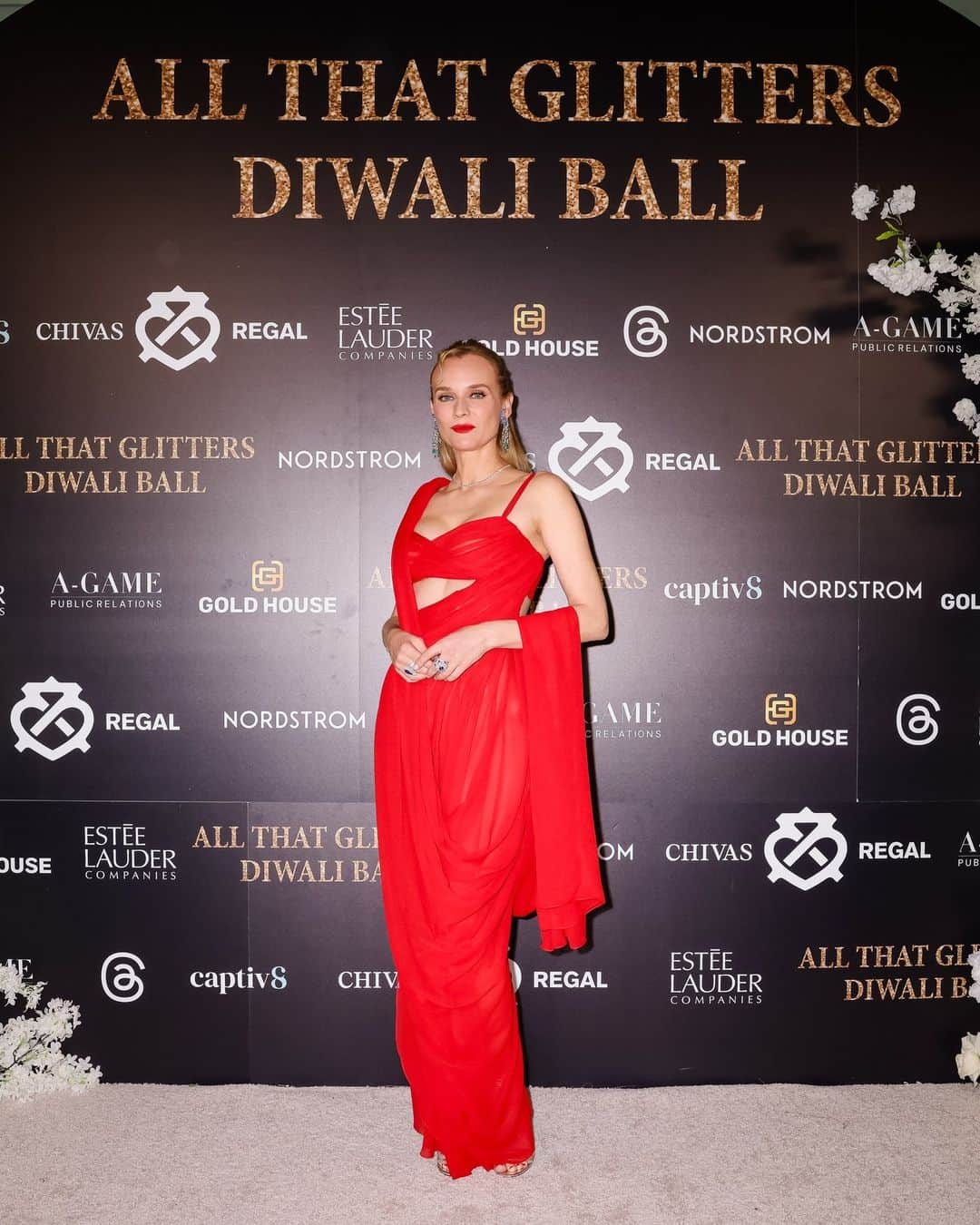 プラバルグルンのインスタグラム：「Divine Diane⁠ ⁠ @dinaekruger wears Atelier Prabal Gurung Scarlet Chiffon Draped Sari Gown to the All That Glitters Diwali Ball @thepierreny⁠ ⁠ Photos by @dianekruger @voguemagazine @bfa」