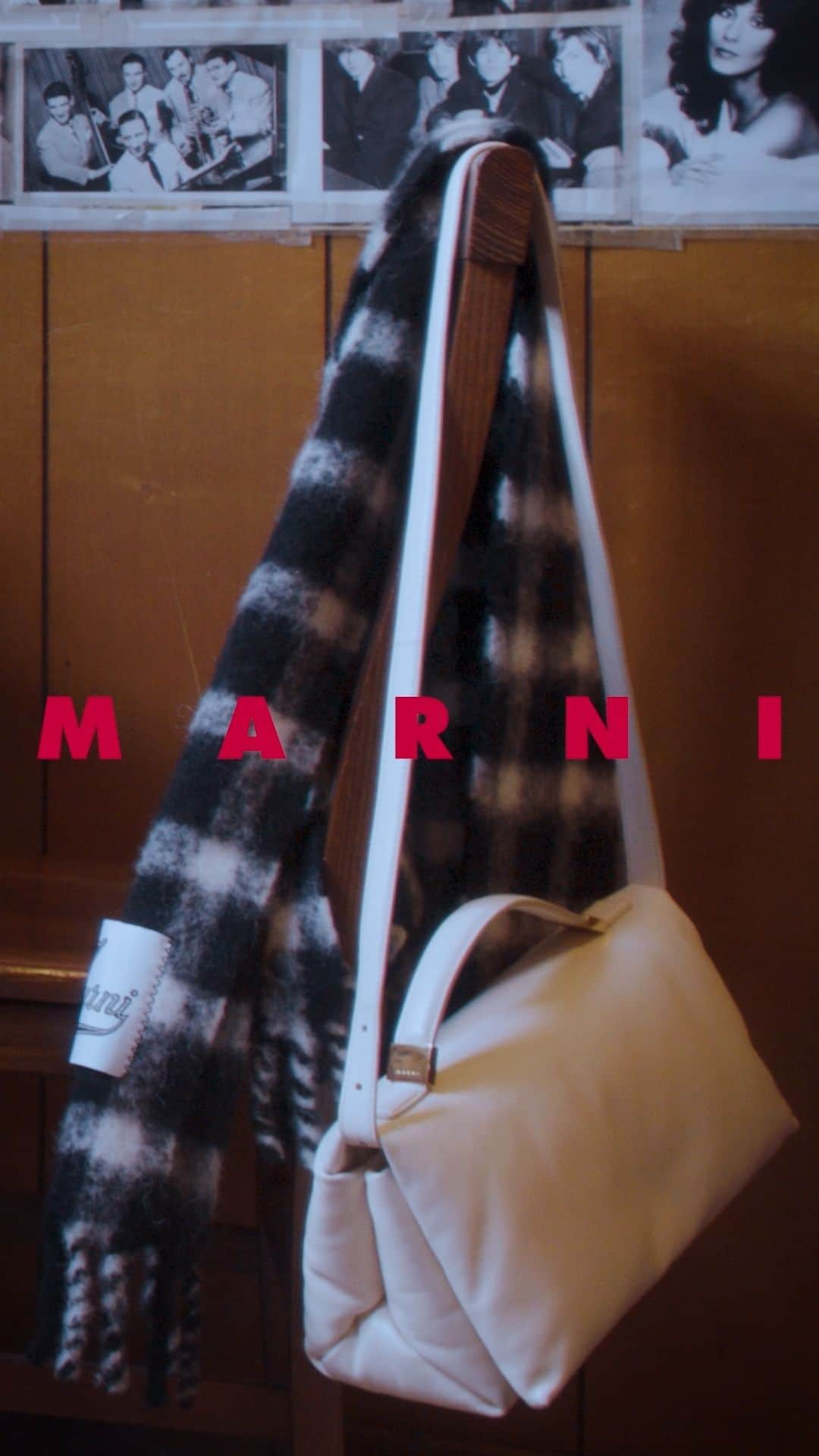 マルニのインスタグラム：「SCENE: IN A CAFÉ   SETUP: A WHITE PRISMA BAG, CHECKS, POIS, MYSTERIOUS INTERLOCUTORS, CONVEXITIES, VOLCANIC EARRINGS, SMILES  LOCATION: CINEMA BELTRADE, MILAN TIME: COFFEE BREAK CHARACTER: SIMONA  #MARNIFW23VOL2 AVAILABLE ONLINE AND IN STORES. LEARN MORE VIA LINK IN BIO​  CREATIVITY & PRODUCTION: @SPRINGSTUDIOS MILAN」