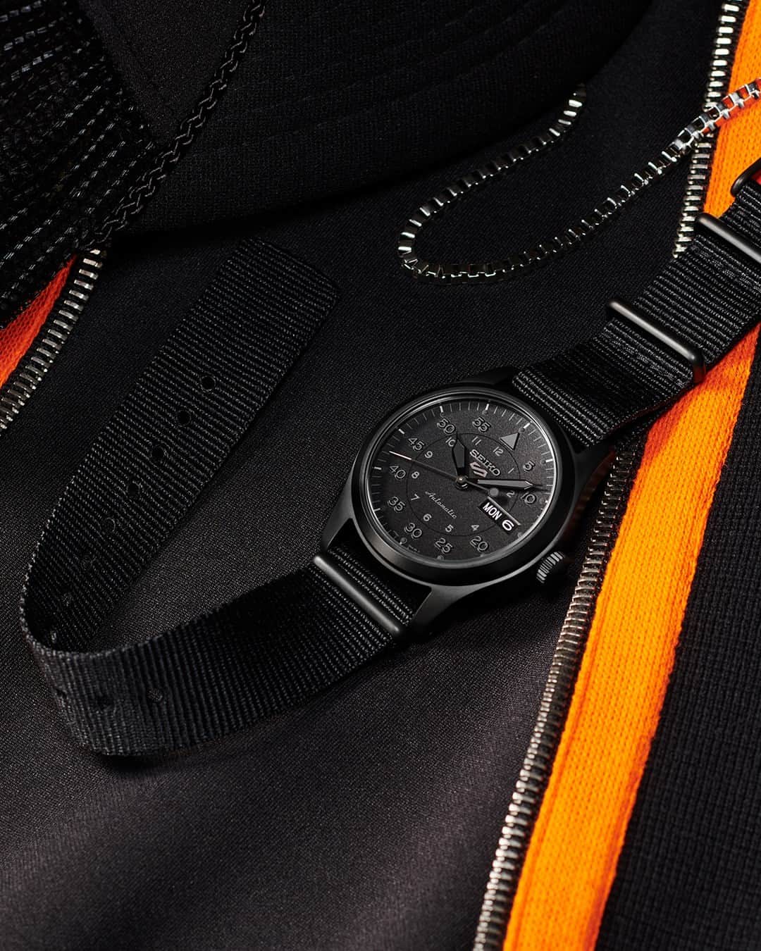 Seiko Watchesのインスタグラム：「Seiko 5 Sports is SCARY Good ⚫🟠 - Pairing all-black street-style with a design inspired by vintage field/military looks, #SRPJ11 adds some intrigue to your everyday attire, especially on a day dedicated to looking scary...good!  #Seiko #Seiko5Sports #ShowYourStyle」