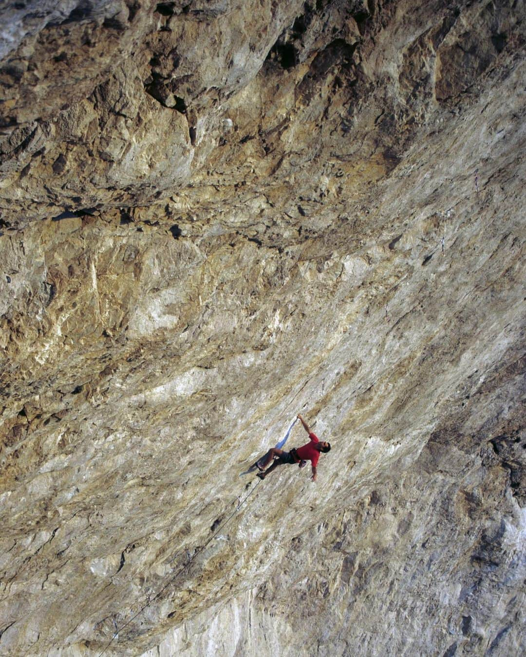 クリス・シャーマさんのインスタグラム写真 - (クリス・シャーマInstagram)「“JUMBO PUMPING LOVE” is NOT the name of the hardest rock climb in America. It could have been. So how does a climb gets its name?   This story started over 3 decades ago, when a  striking, but faint line of pockets - viewed through my binoculars - eventually became one of the most difficult and famous rock climbs in the world.   On a cold November day in 1991, perched near the summit of remote Clark Mountain, I embarked on a top down inspection of what was the most king line I ever found. Wild swings into the wall to place bolts revealed section after section of V-hard boulder problems. My psyche was high as I slowly and methodically continued down, placing bolts.   It became abundantly clear to me that this entire climb would go, but at a standard much more difficult than the hardest grade in 1991. I thought maybe this would be possible as a multi pitch climb. I tried it, was unable to make it to the halfway anchors, so I set my sights on the other king line to the left which I named Jumbo Pumping Hate (5.14a).  Fast forward to 2008, when Chris Sharma redpointed my original king line project. In true Sharma fashion, he brought it to a new level by climbing the entire wall in one very long pitch. He named this “Jumbo Love” and graded it 5.15b. It stood as the hardest and proudest sport climb in America for 14 years. There were a few repeats by America’s strongest sport climbers. In 2013, I belayed Sharma on a hard start (bolted by Jorge Visser) to Jumbo Love. This was like adding a 5.14b, with no rest, to a long 5.15b. I tried to do the math… how hard could this be?  The direct start to Jumbo Love remained un-redpointed until October 2022, when Seb Bouin linked it all together. So how does a route get its name? What would Seb name it? Do you honor the history in your name as Sharma did with Jumbo Love, or do you call it something completely different? Seb messaged Chris and me. With a little back and forth, he decided on “Suprême Jumbo Love” (5.15c).  Photos tagged: Suprême 2022 Suprême in 2013, 2 photos  JPH in the 90s  #climbinghistory #originofclimbingroutenames #clarkmountain」11月1日 2時13分 - chris_sharma