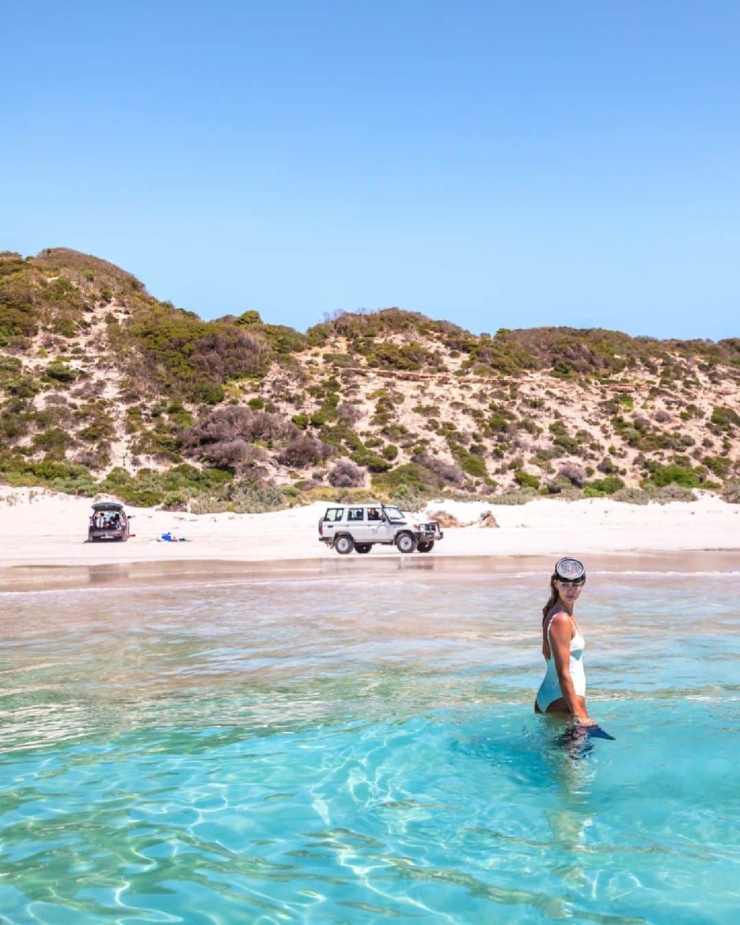 Australiaさんのインスタグラム写真 - (AustraliaInstagram)「PSA: @authentickangarooisland is the No. 2 must-visit global destination for 2024! 📣 @lonelyplanet recently named #KangarooIsland in their annual global hotlist - a guide to THE must-visit travel destinations worldwide. It’s easy to see the appeal of this picturesque island off the coast of Tarntanya (@cityofadelaide), especially for business events groups - it’s packed with #Aussie wildlife, unspoiled beaches, unique natural wonders and a flourishing food and wine scene. To top things off, @qantas has expanded its flight schedule to the island from summer 23/24, and @southernoceanlodge - one of the @luxurylodgesofaustralia - is reopening on December 6th, providing a luxury 25-suite base from which incentive groups can explore this breathtaking slice of @southaustralia.   (📸: @southaustralia)  #SeeAustralia #ComeAndSayGday #MeetinAus #SeeSouthAustralia #AuthenticKI  ID: A woman stands in the crystal-clear blue water with a snorkelling mask pulled up on her forehead. Behind her on the beach, two 4WD are parked on the white sand. Shrubs cover the large sand dunes behind them.」11月1日 18時00分 - australia