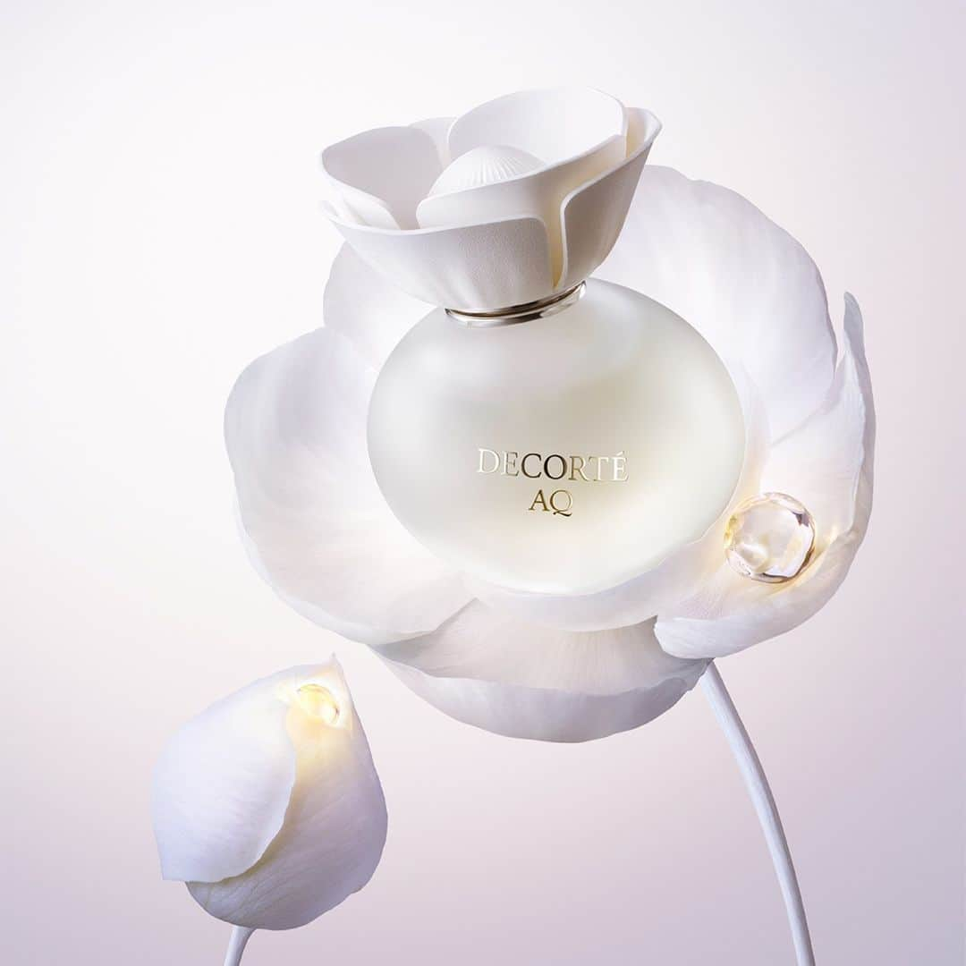 DECORTÉのインスタグラム：「Introducing the NEW AQ Eau de Parfum. A delicate fragrance that wraps your senses in warmth this season with a unique blend of Magnolia Champaca, Queen of the Night and Natural Sublime Rose Essence. Available now at decortecosmetics.com.」