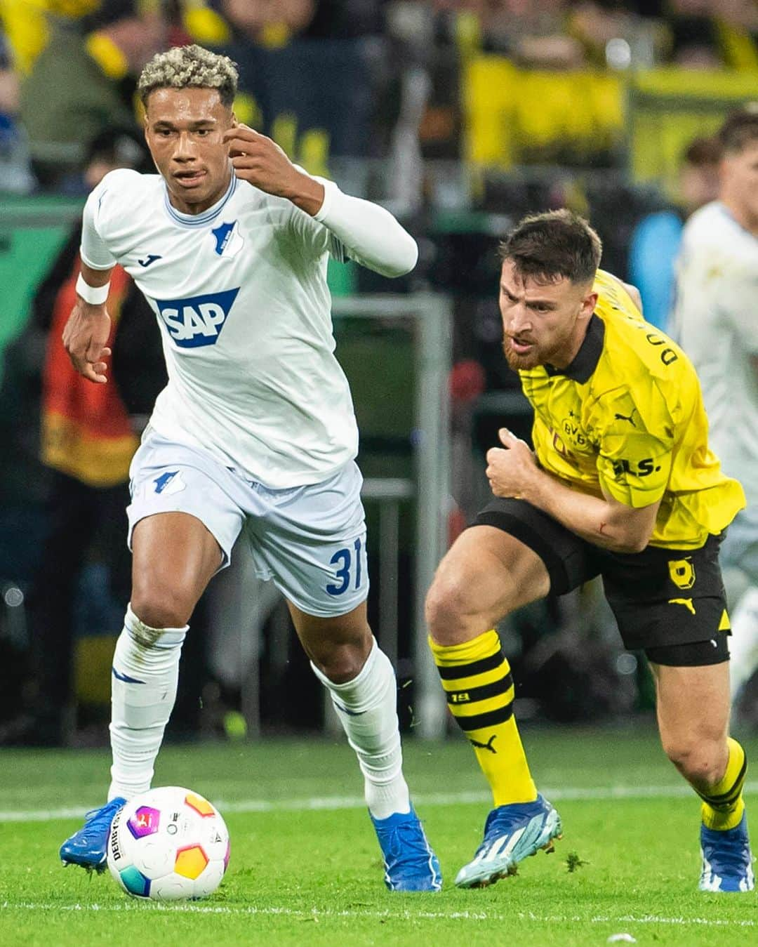 TSG1899ホッフェンハイムのインスタグラム：「Schade, dass es in Dortmund nicht zum Weiterkommen gereicht hat. Aber: Wir freuen uns mit Bambasé Conté, der sein Debüt in einem Pflichtspiel bei den Profis gefeiert hat! 👍  Der 20-Jährige war im Jahr 2018 in die TSG-Akademie gewechselt, vor wenigen Monaten rückte er in den Profikader auf.   Herzlichen Glückwunsch, Bamba - weiter so! 💙🤍  @tsgakademie 🤝 @tsghoffenheim」