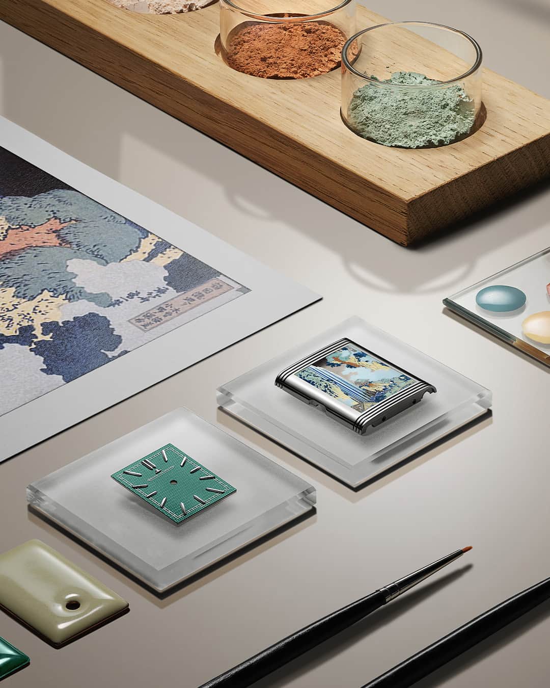 ジャガールクルトのインスタグラム：「A work of artistry. #Reverso _ Reverso Tribute Enamel Hokusai Designed, made and assembled in our Manufacture _ Showcasing the talents housed in the Métiers Rares Workshop, the new Reverso Tribute Enamel Hokusai celebrates the ‘Waterfalls’ series created by Hokusai. Our craftsmen, in addition to reproducing the artist’s initial colours, had to precisely replicate every detail with pinpoint accuracy on a scale approximately one-tenth of the original. _ #JaegerLeCoultre #Reverso」