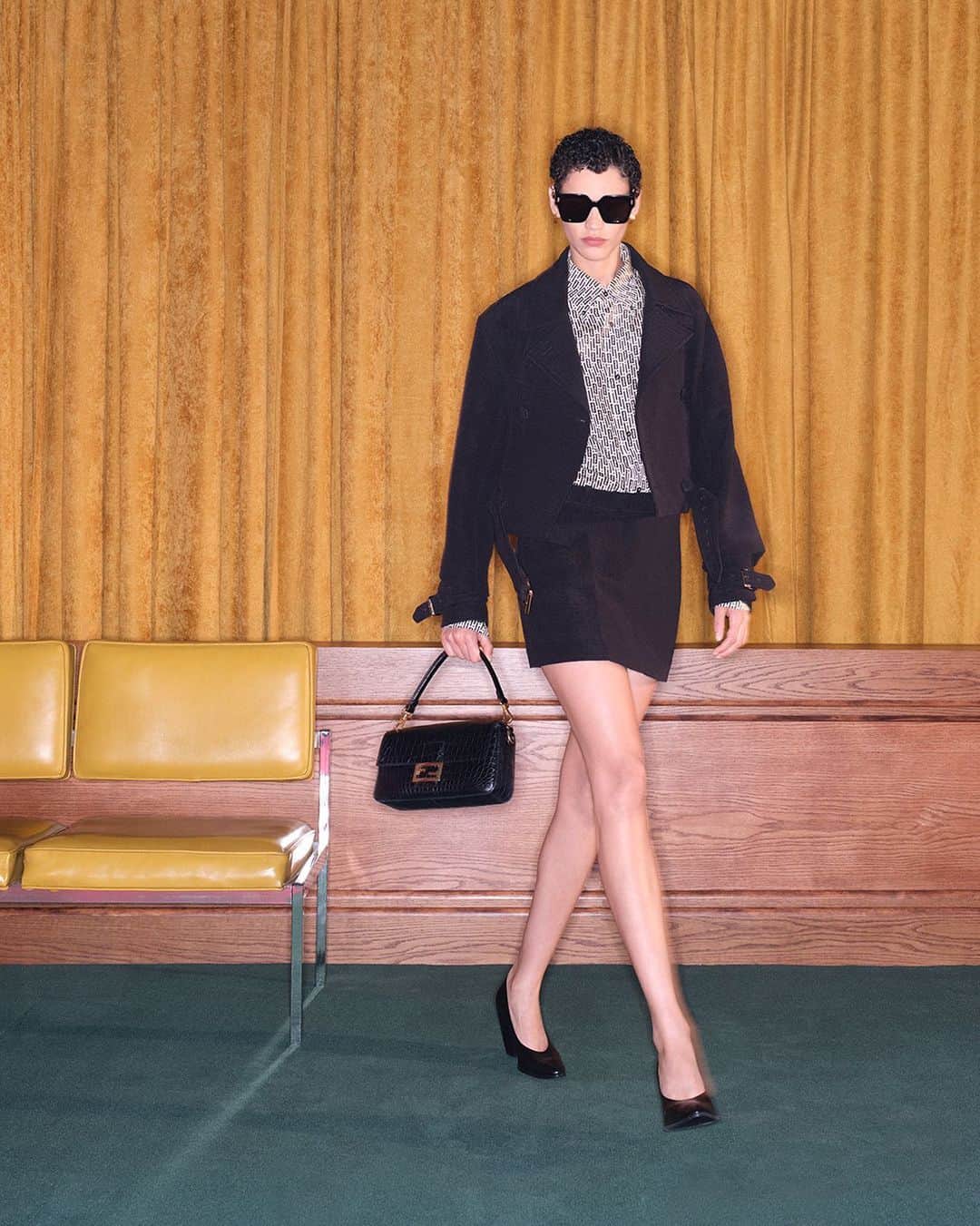 Fendiのインスタグラム：「A precious iteration of the #FendiBaguette adds a timeless touch of Fendi heritage to a new #FendiWinter look.  Curated with: @stefanopilati  Artistic Director of Couture and Womenswear: @mrkimjones  Artistic Director of Accessories and Menswear: @silviaventurinifendi  Artistic Director of Jewellery: @delfinadelettrez  Styling: @elliegracecumming Hair: @jawaraw Makeup: @hannah_murray1  Casting: @shelleydurkancasting Model: Kerolyn Soares  Photography: @johnnydufort  Set Design: @maxbellhouse」
