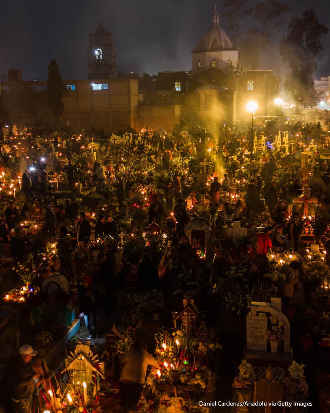 ABC Newsのインスタグラム：「People light hundreds of candles to decorate the graves of their relatives in a ceremony called alumbrada, as part of the Day of the Dead celebrations in Mexico.」