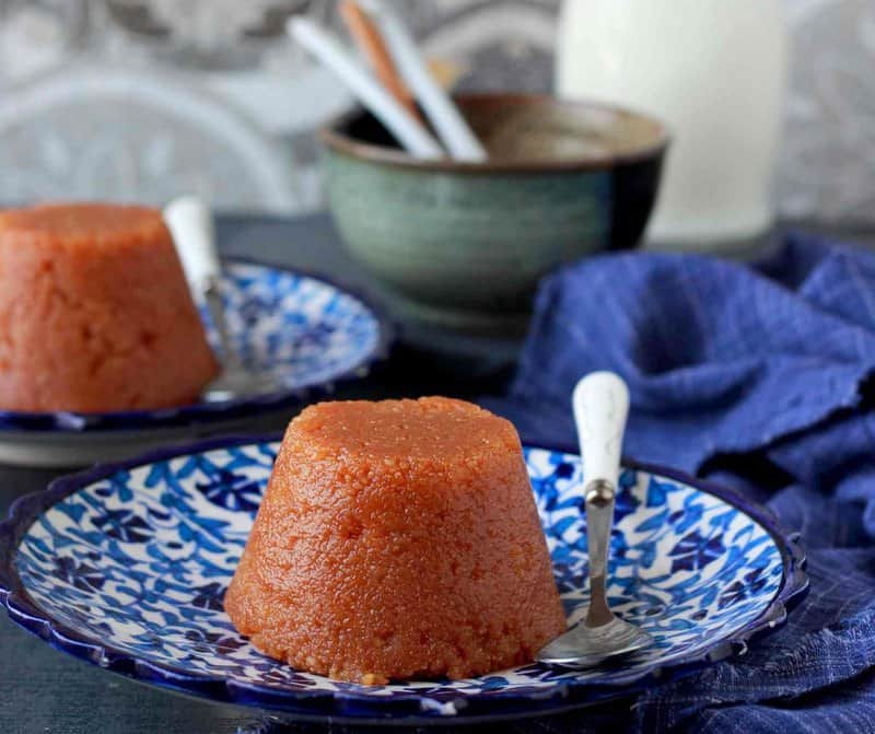 Archana's Kitchenのインスタグラム：「#Diwalirecipes   Mukhadi Halwa would be a perfect dessert to serve at your Diwali party! The creamy texture of the Halwa would complement the spiciness of your main course, while its unique flavours would add an extra dimension to the meal. Whether you are entertaining guests or simply treating yourself to a delicious dessert, Mukhadi Halwa is sure to impress.  1 cup Sooji 3 tablespoons All Purpose Flour  1 cup Milk, +1/3 cup extra 1 cup Sugar 3/4 cup Ghee  👉To begin making the Mukhadi Halwa recipe, remove 3 tablespoons of semolina from one cup of semolina. and replace it with 3 tablespoons of all purpose flour.  👉Transfer this mix into a bowl and add milk. Whisk them together and set aside while you begin to prep for caramelising the sugar. 👉Heat a heavy-bottomed pan, add ghee and once it begins to get hot (not smoking), reduce the heat to medium.  👉Add sugar and level it in ghee using a spatula. After five minutes stir the sugar using a spatula (using spatula helps ensure that the caramel won’t stick to it).  👉Keep stirring once in a while till the sugar starts caramelizing as it melts. (The colour of the caramel should not deepen or darken in colour as this will lead to a bitter tasting halwa) 👉Give a quick stir to the flour-semolina batter and slowly add it to the caramelised sugar. 👉Now, starts the tricky part. Hold the wok or pan firmly using a cloth or holder (to avoid the heat) so that you can work your way with the batter.  👉Using ladle (a large heavy spoon/ kalchhul), carefully yet swiftly start mixing the batter into the caramel. The batter will seem to turn lumpy but nothing to worry. 👉Increase the flame to medium and using the back of the spoon keep smashing the batter, especially the whitish lumps, till the whole batter gets completed assimilated and incorporated with the caramel and the halwa wears a homogeneous look. 👉At this point, remove excess oil in a small bowl and again roast the halwa for 3 to 4 minutes. Switch off the heat and push the halwa towards the edge of one side of the wok to allow any excess ghee to drain in the centre.」